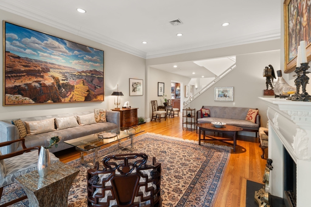 214 Allandale Road, Unit D Boston, MA 02467 - Photo 8 of 40 a living room with furniture and a flat screen tv