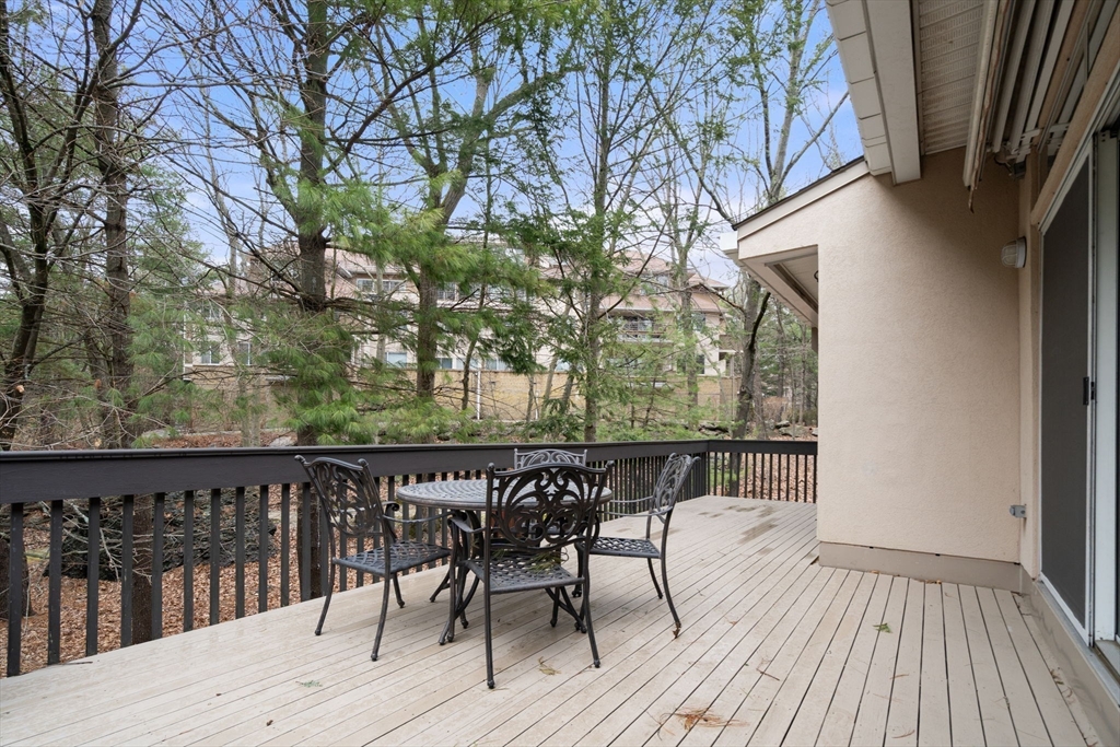 214 Allandale Road, Unit D Boston, MA 02467 - Photo 10 of 40 a view of deck with patio and wooden floor