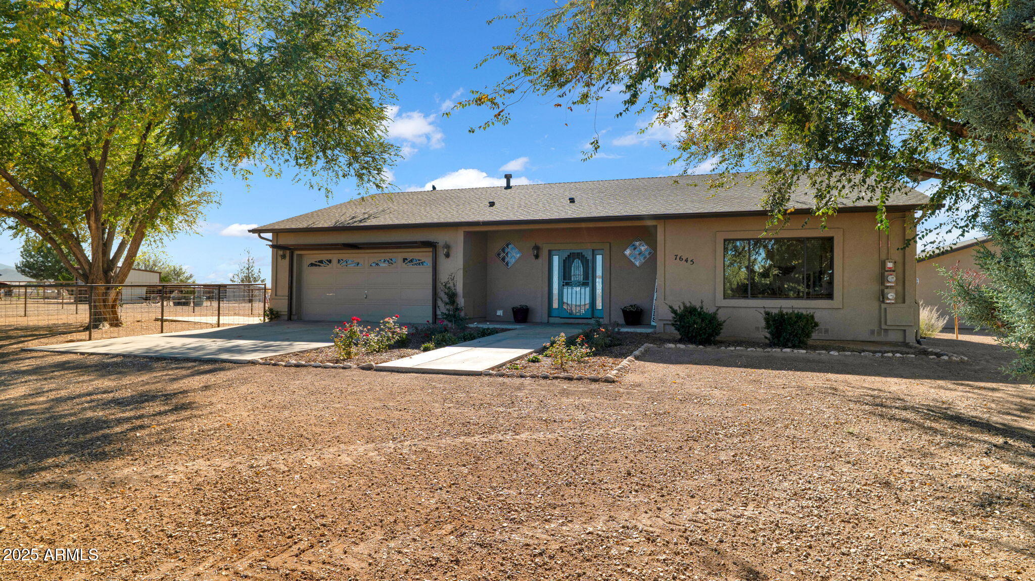 7645 Memory Lane Prescott Valley, AZ 86315 - Photo 29 of 79 a front view of a house with a yard and garage