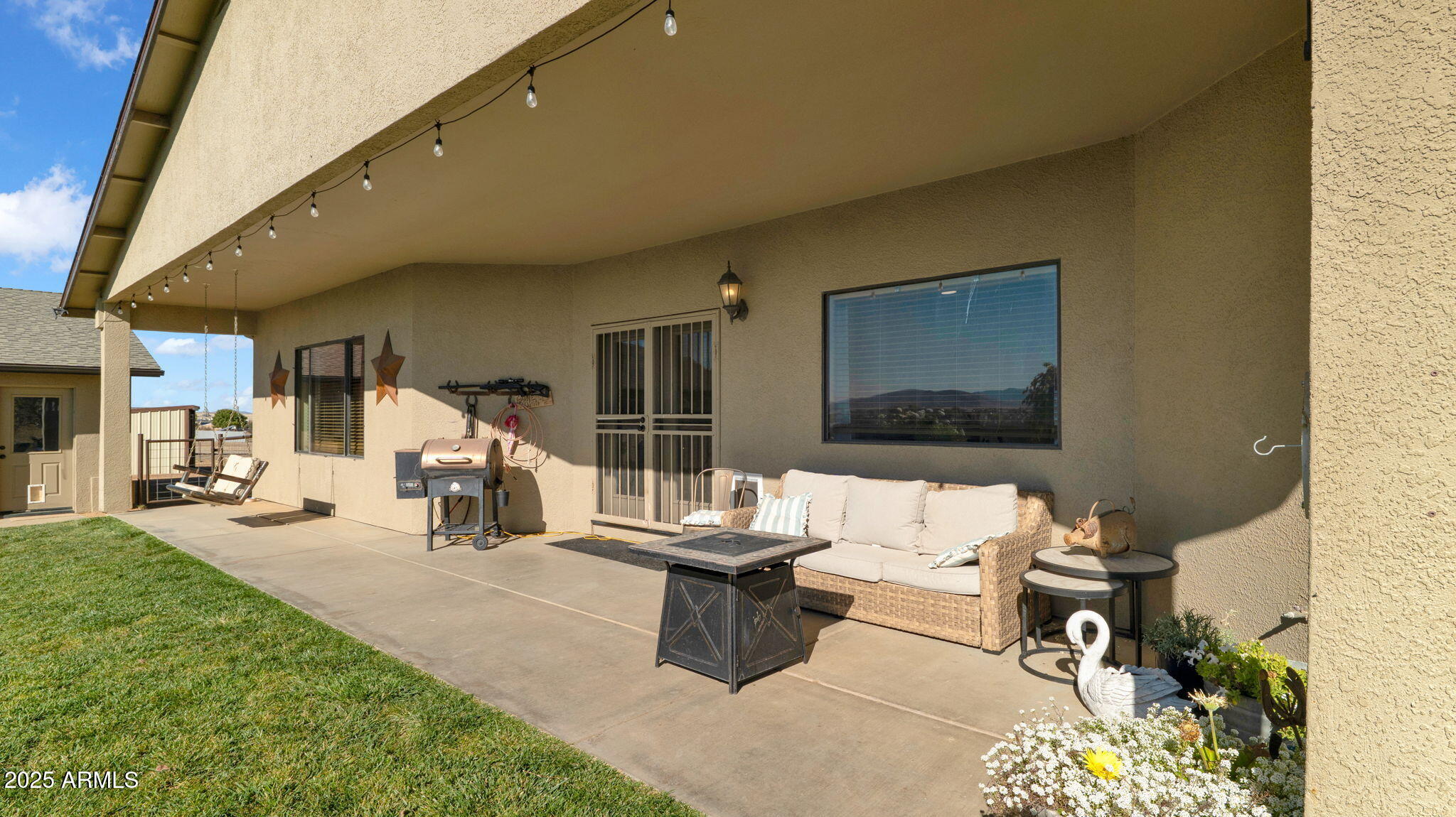 7645 Memory Lane Prescott Valley, AZ 86315 - Photo 42 of 79 a building outdoor space with patio furniture and potted plants