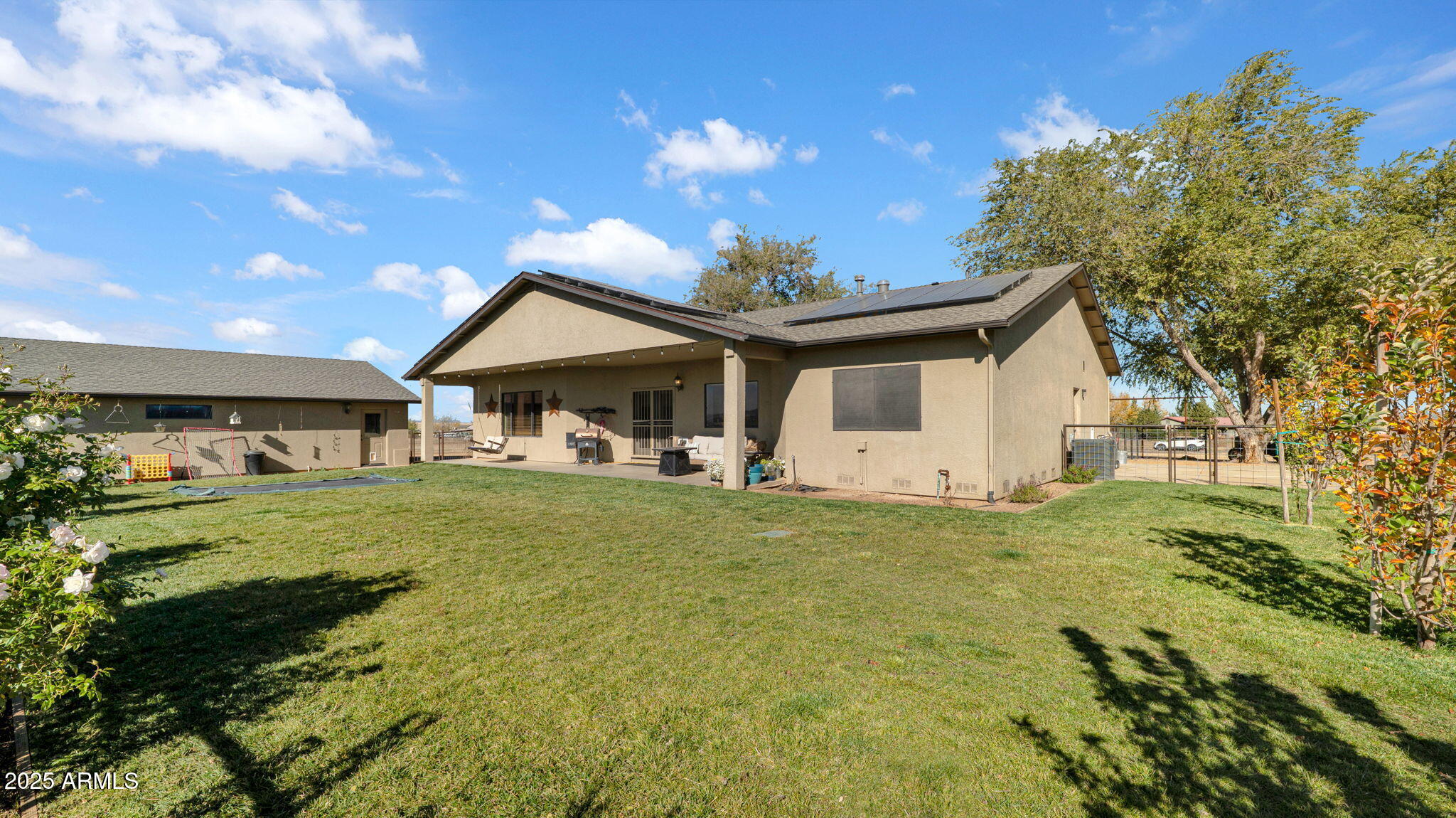 7645 Memory Lane Prescott Valley, AZ 86315 - Photo 43 of 79 a front view of a house with a garden