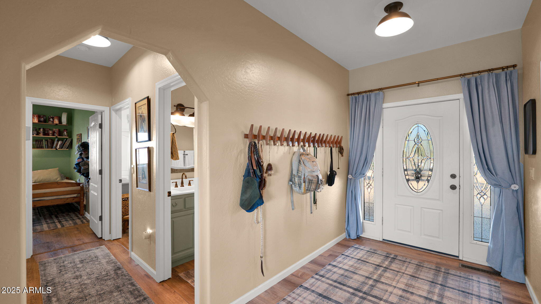 7645 Memory Lane Prescott Valley, AZ 86315 - Photo 64 of 79 a view of a hallway with bathroom and glass door