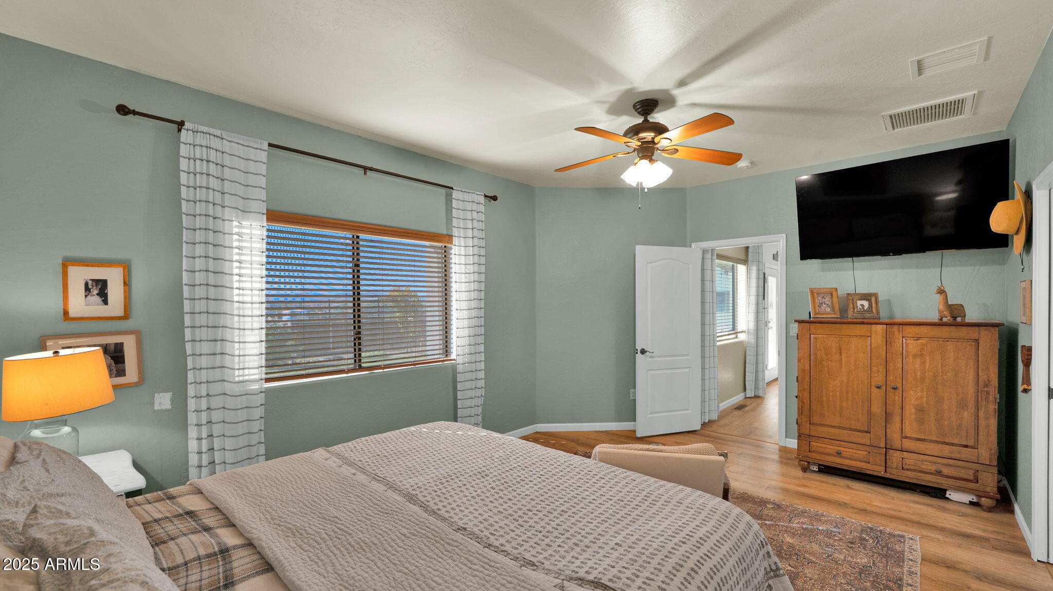 7645 Memory Lane Prescott Valley, AZ 86315 - Photo 67 of 79 a bedroom with a bed and a flat screen tv
