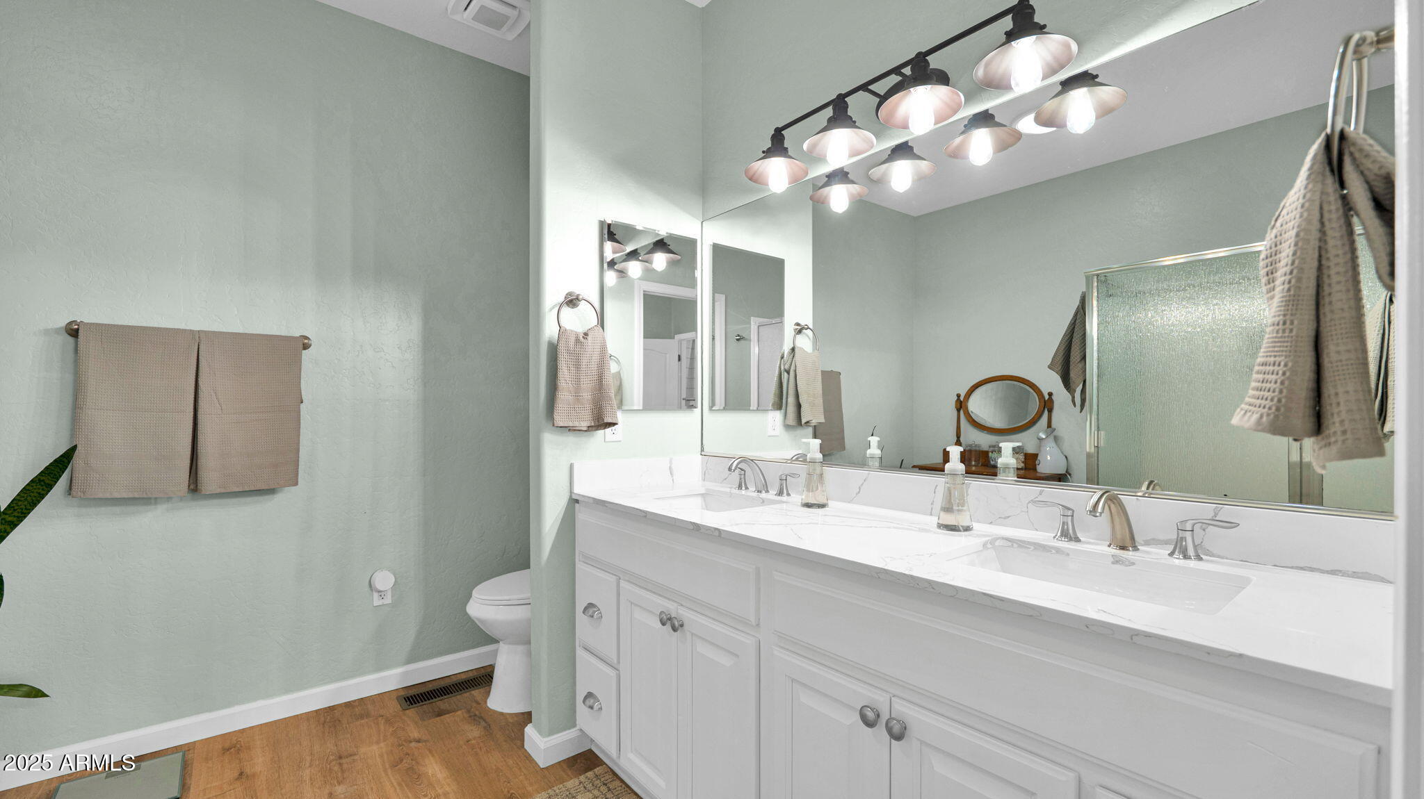 7645 Memory Lane Prescott Valley, AZ 86315 - Photo 68 of 79 a bathroom with a double vanity sink and a mirror