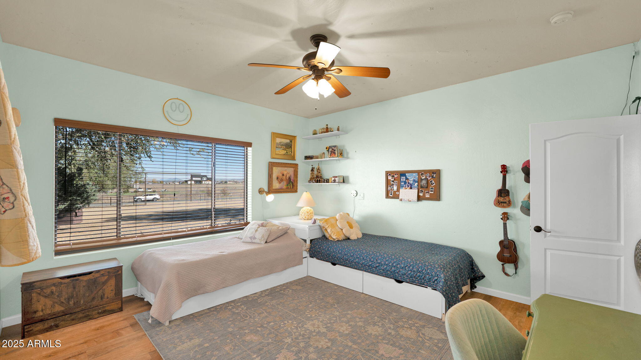 7645 Memory Lane Prescott Valley, AZ 86315 - Photo 74 of 79 a bedroom with a bed and a large window with the outer view