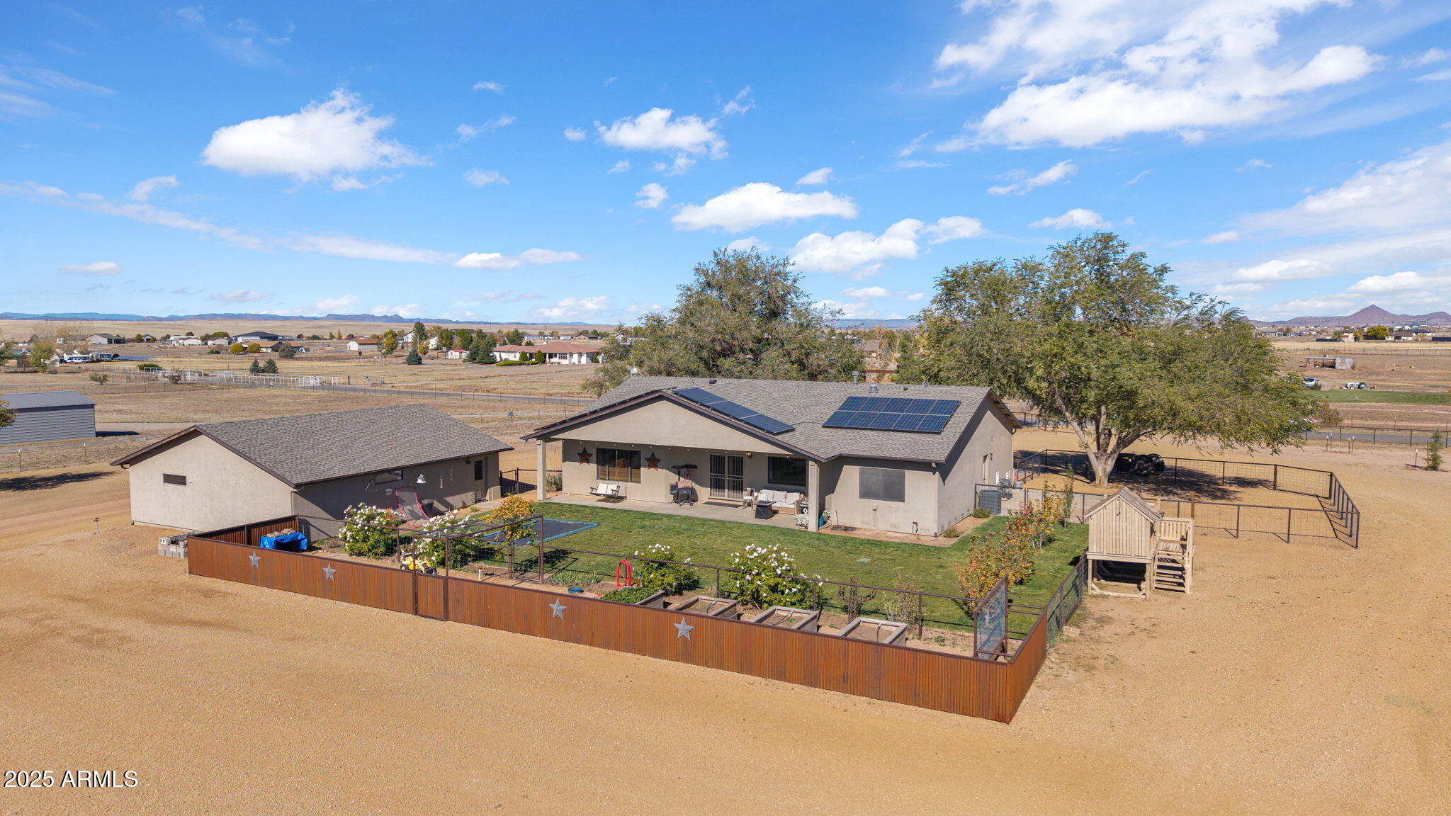 7645 Memory Lane Prescott Valley, AZ 86315 - Photo 6 of 79 a aerial view of a house with swimming pool and mountains
