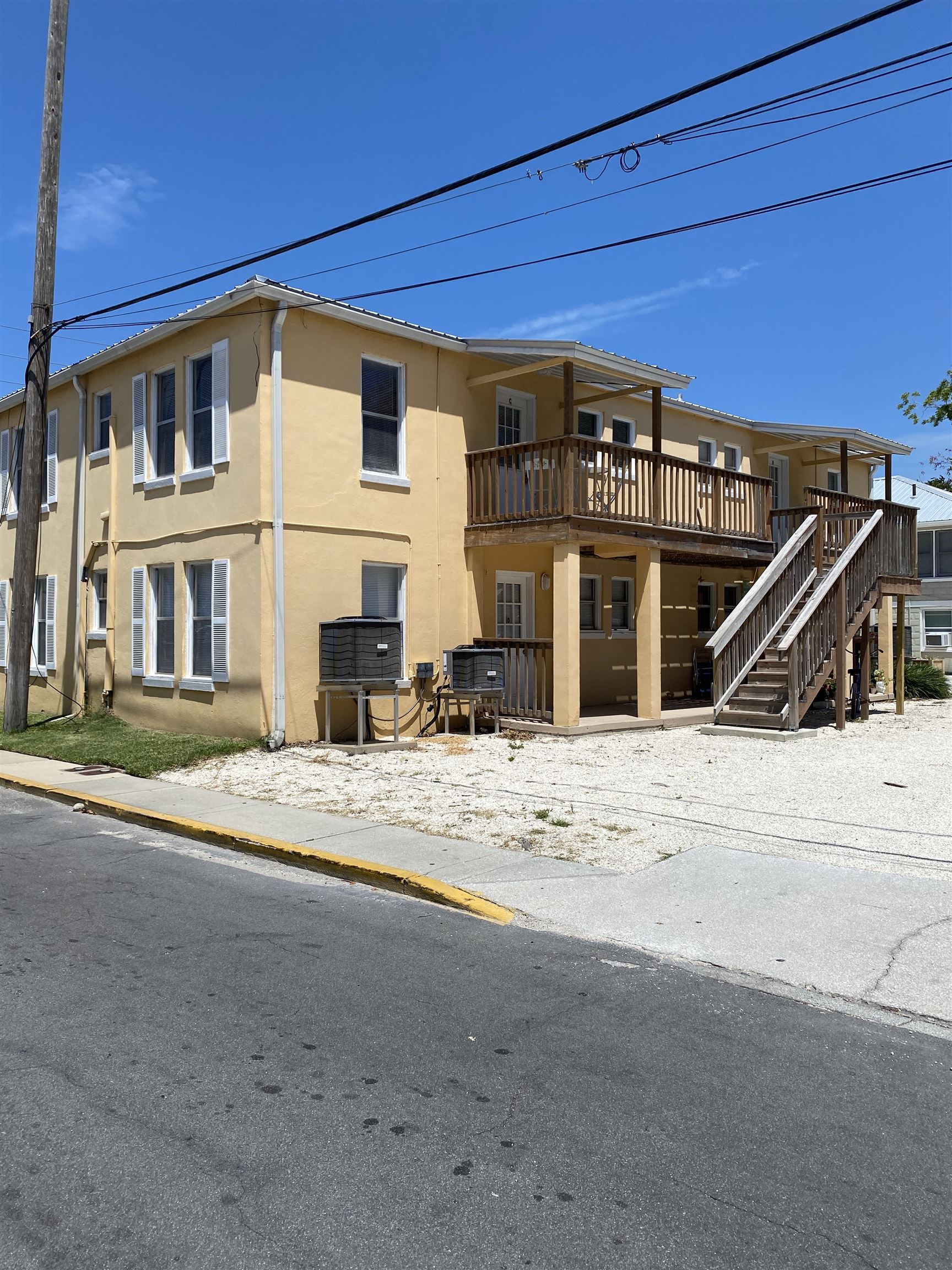 147 Riberia Street, Unit C St. Augustine, FL 32084 - Photo 18 of 23 a view of a house with wooden stairs
