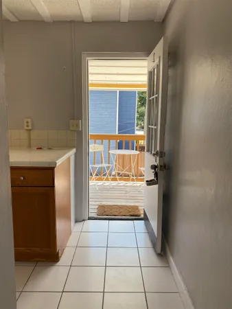 a kitchen with a sink a counter top and a window