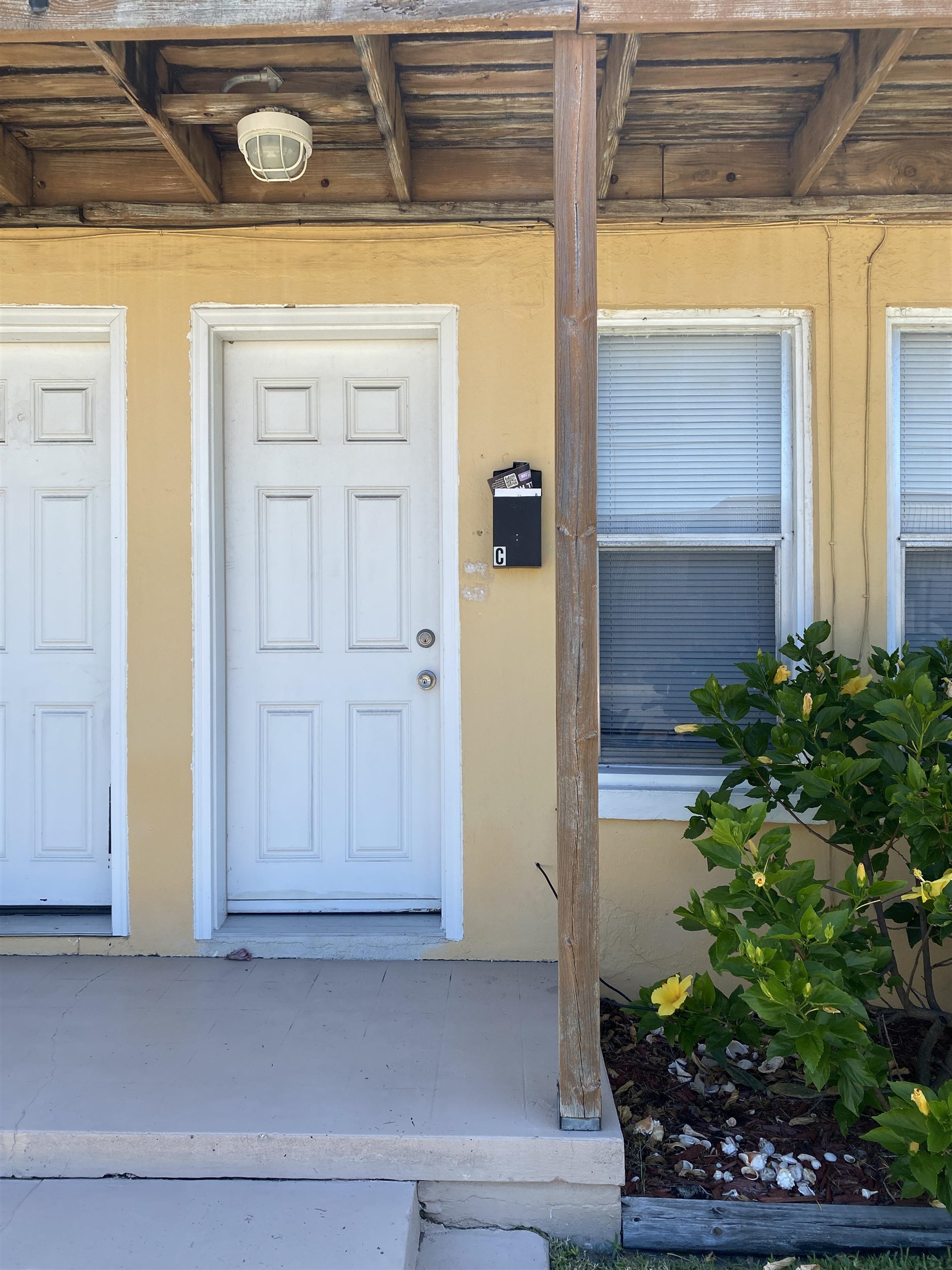 147 Riberia Street, Unit C St. Augustine, FL 32084 - Photo 21 of 23 a front view of a house with a yard