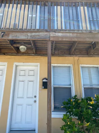 a view of front door of house with yard