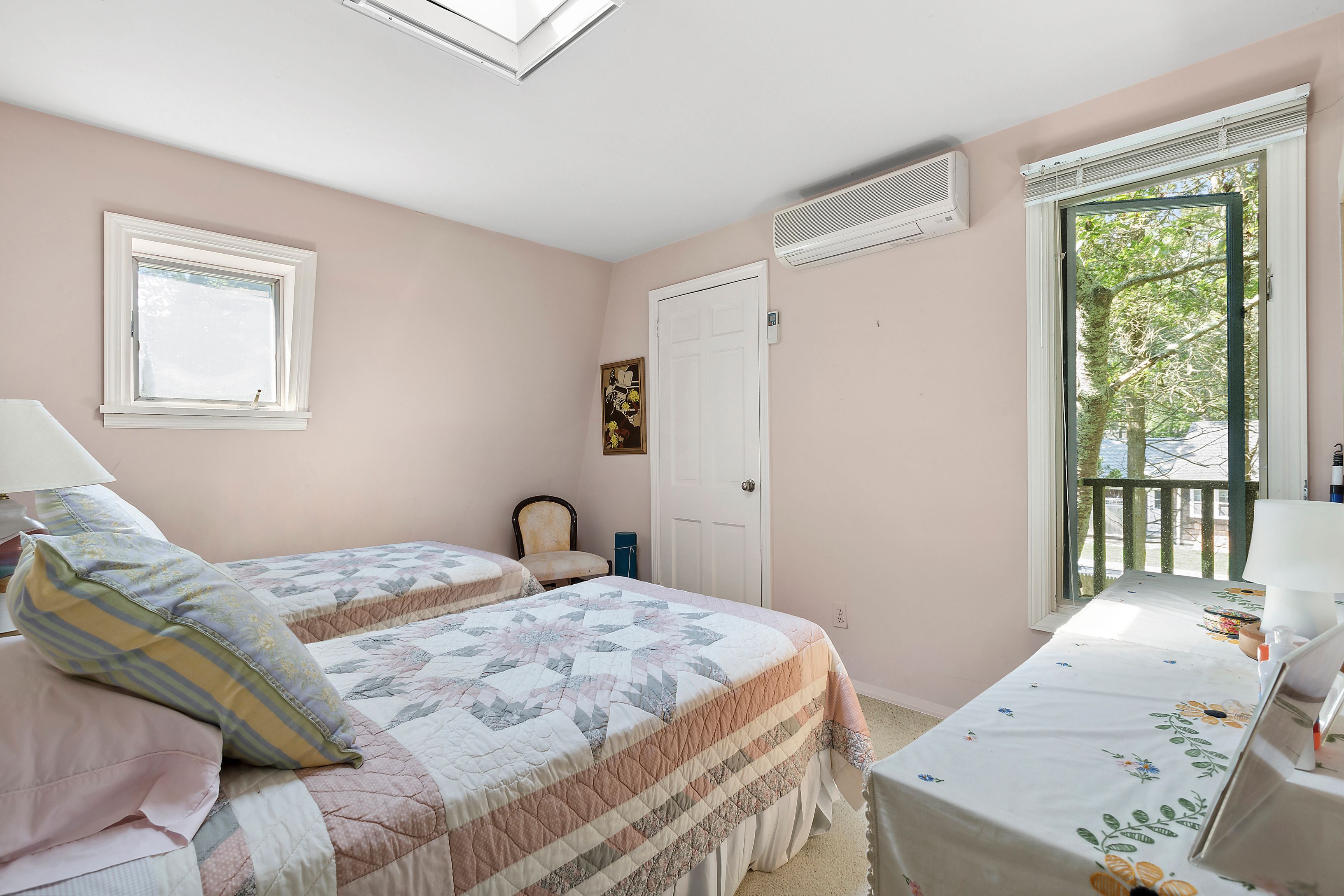 57 Wireless Road East Hampton, NY 11937 - Photo 17 of 27 a bedroom with a bed and a window