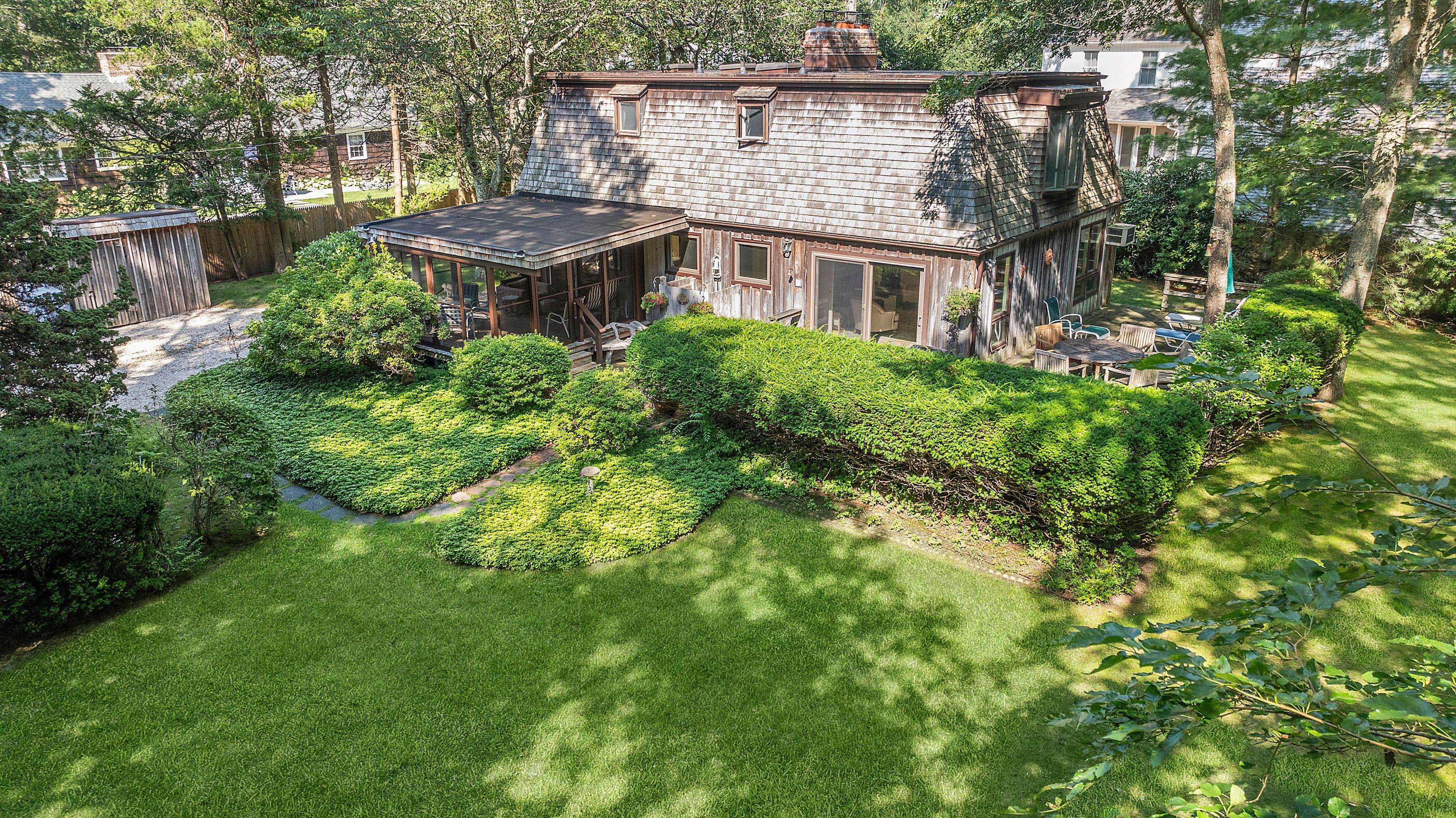 57 Wireless Road East Hampton, NY 11937 - Photo 25 of 27 a view of a house with a yard and sitting area
