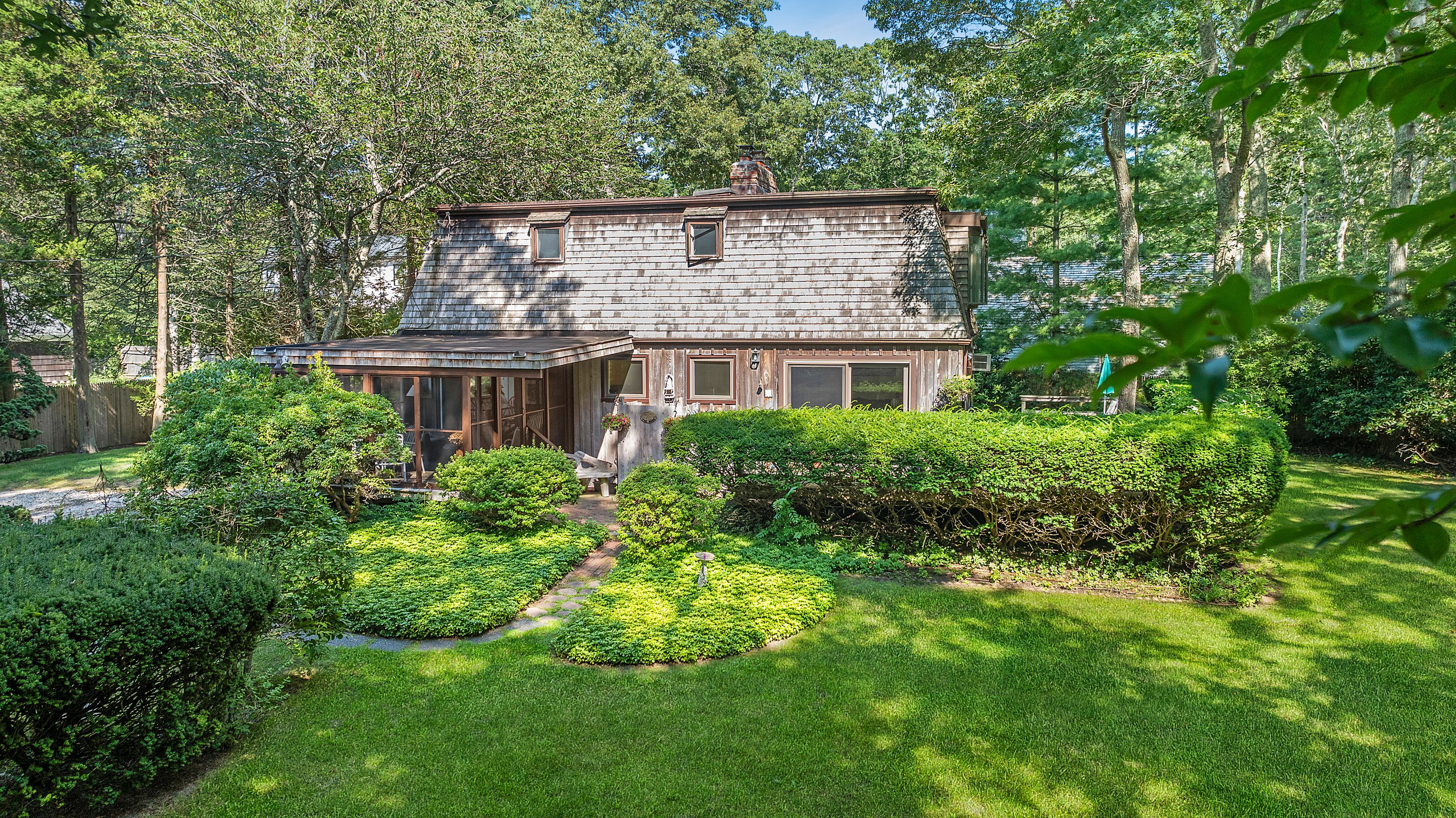 57 Wireless Road East Hampton, NY 11937 - Photo 3 of 27 a view of a house with a yard and plants