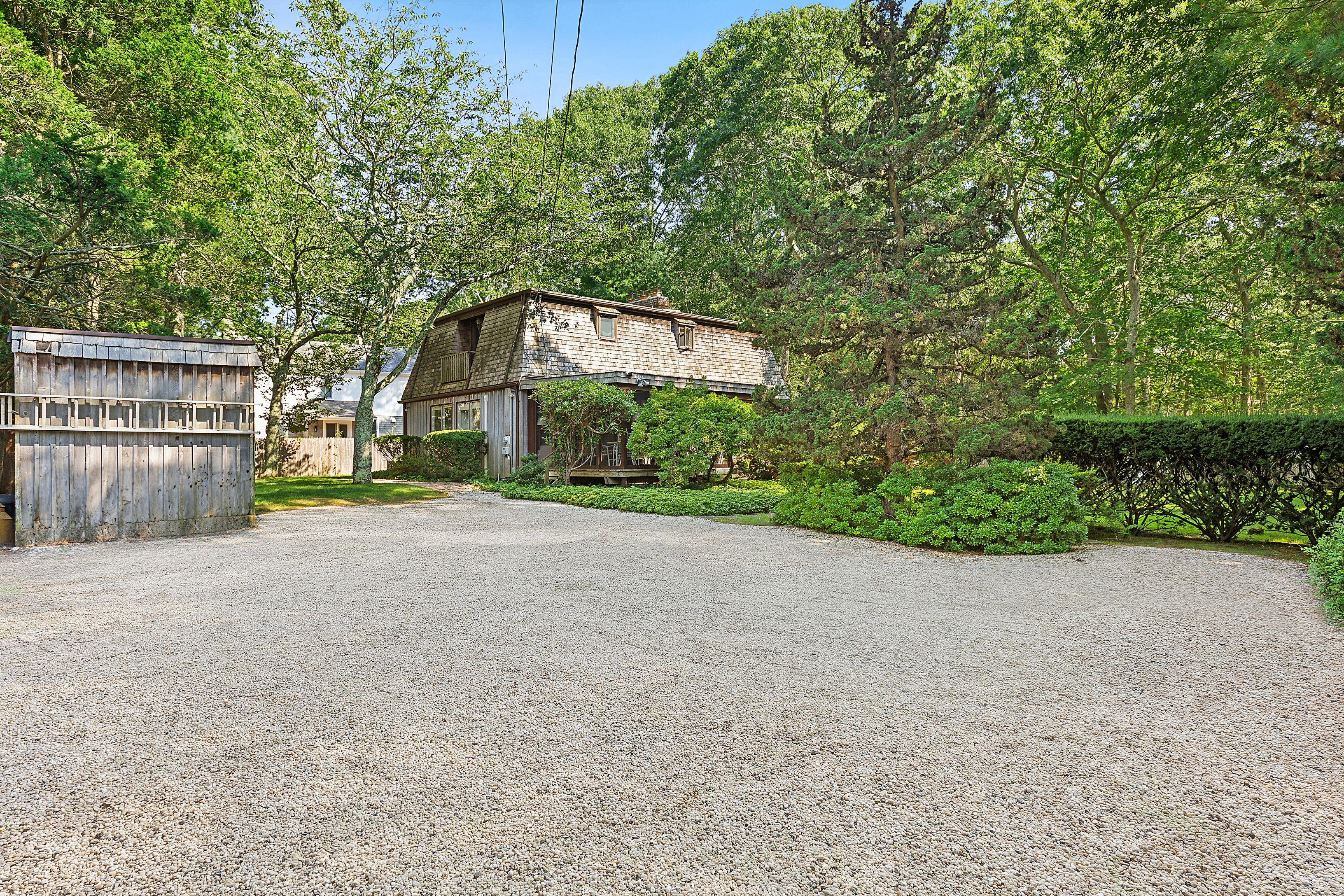 57 Wireless Road East Hampton, NY 11937 - Photo 4 of 27 a view of a house with a yard and large tree