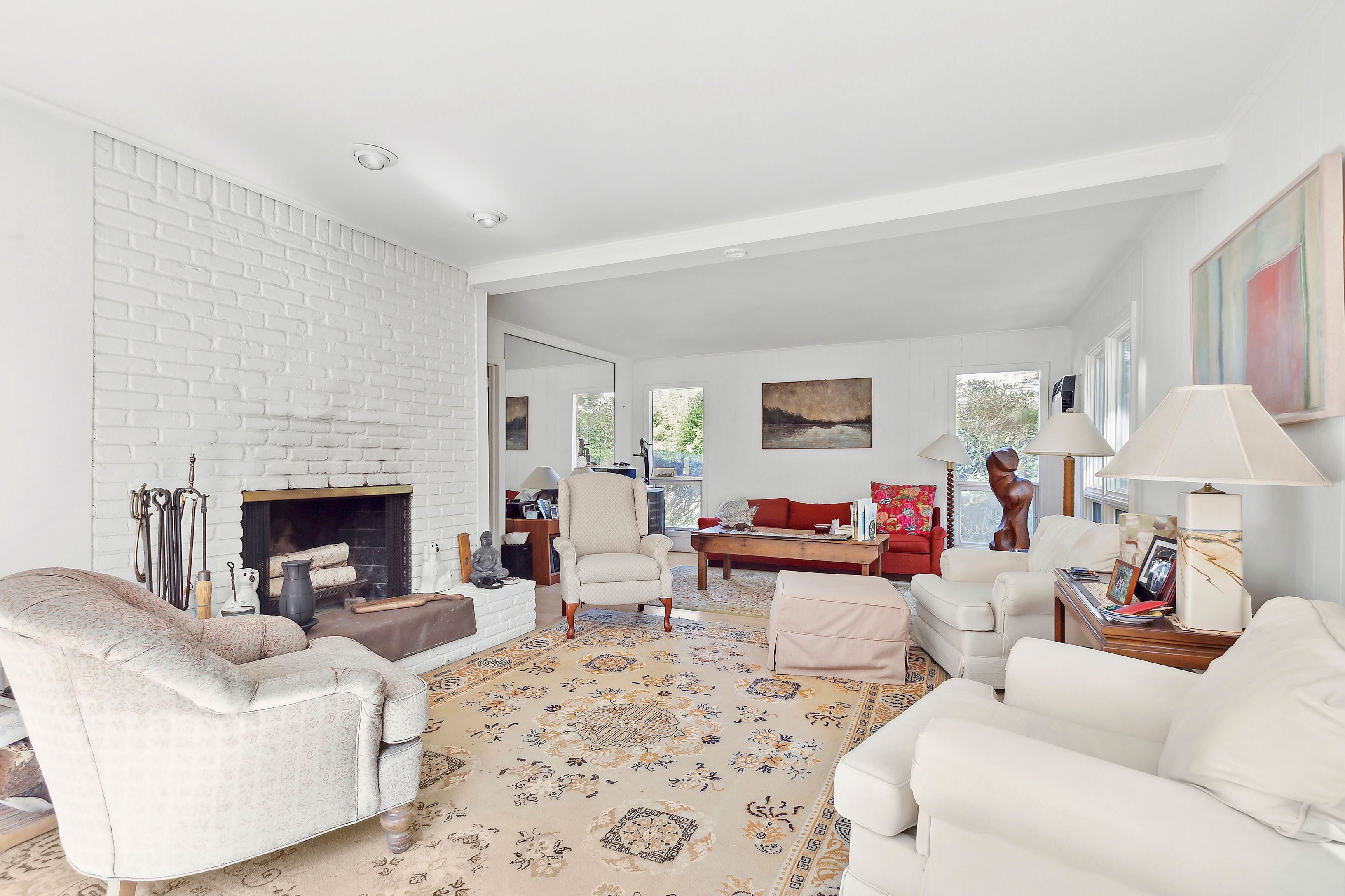 57 Wireless Road East Hampton, NY 11937 - Photo 7 of 27 a living room with furniture a fireplace and a table