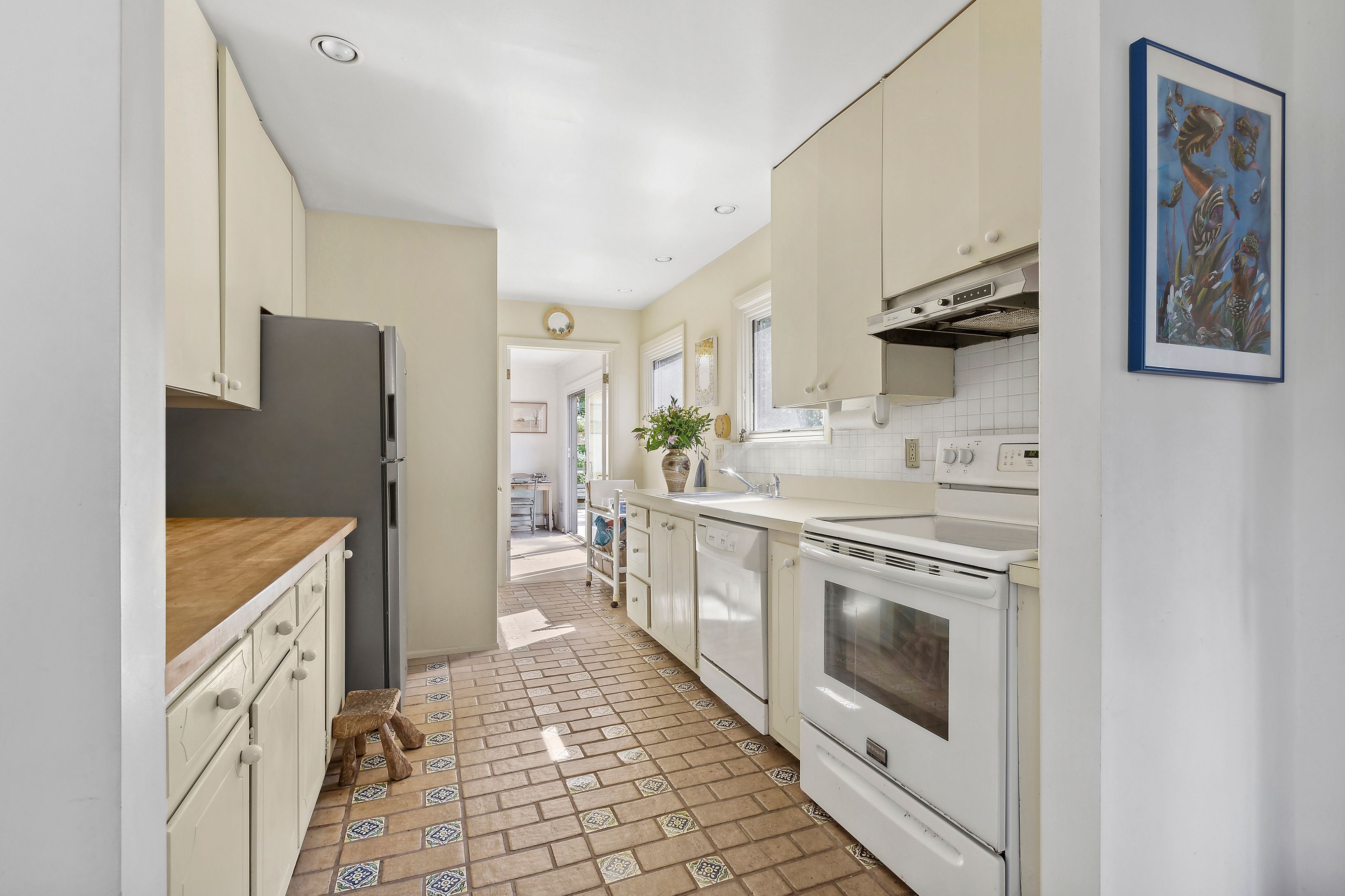 57 Wireless Road East Hampton, NY 11937 - Photo 8 of 27 a kitchen with stainless steel appliances granite countertop a stove and a refrigerator