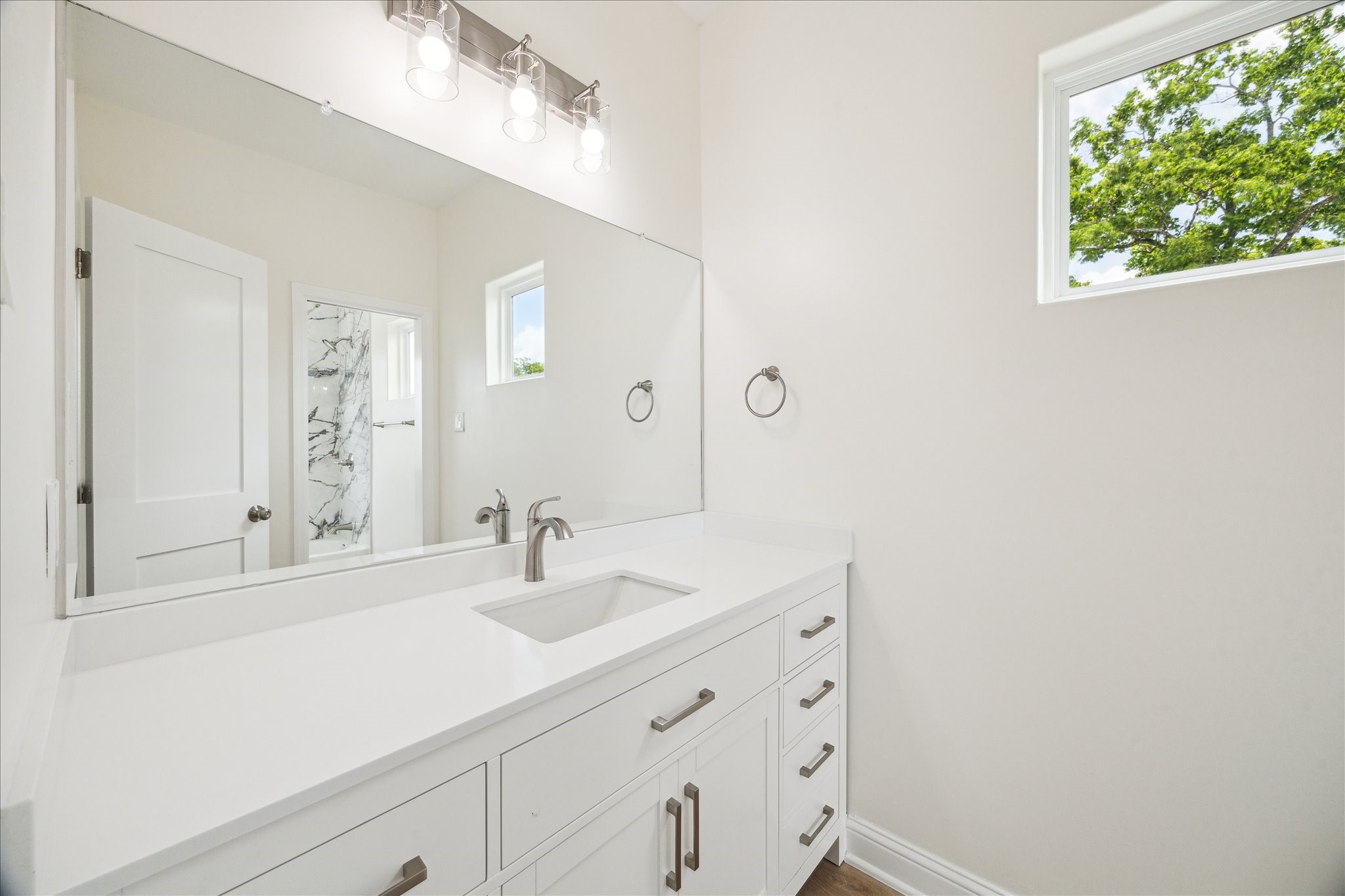 901 East 37th Street Houston, TX 77022 - Photo 16 of 19 a bathroom with a sink and a mirror