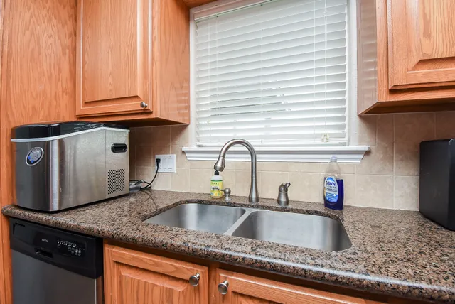 a stove top oven sitting inside of a kitchen