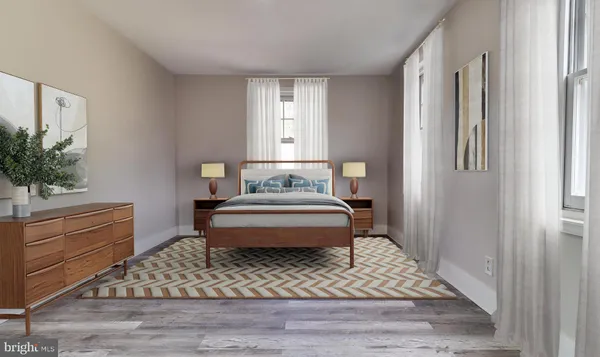 a bedroom with a bed and a potted plant