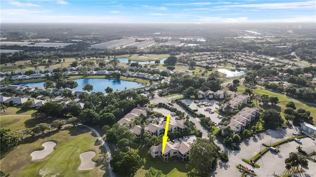 an aerial view of city and lake