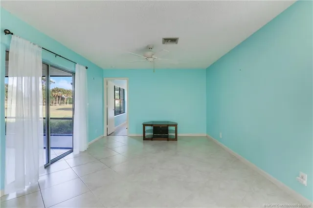 a view of a livingroom with furniture and hardwood floor