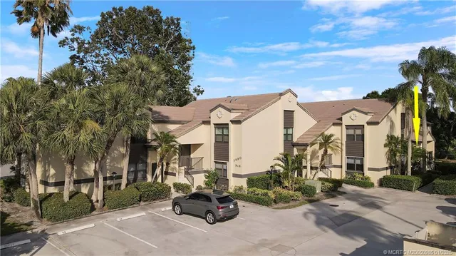 a view of a street with a cars park in front of it