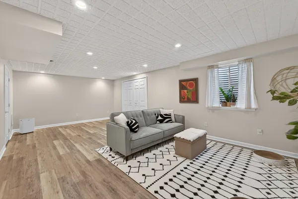 a living room with furniture and a rug