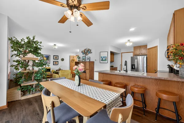 a view of a dining room with furniture and wooden floor