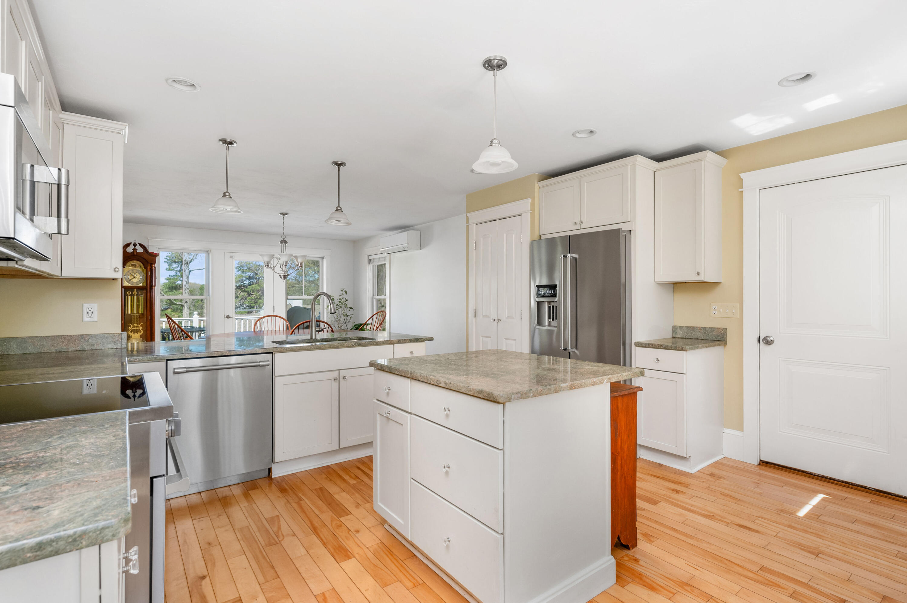110 Clamshell Cove Road Cotuit, MA 02635 - Photo 13 of 56 a kitchen with stainless steel appliances granite countertop a sink stove and refrigerator