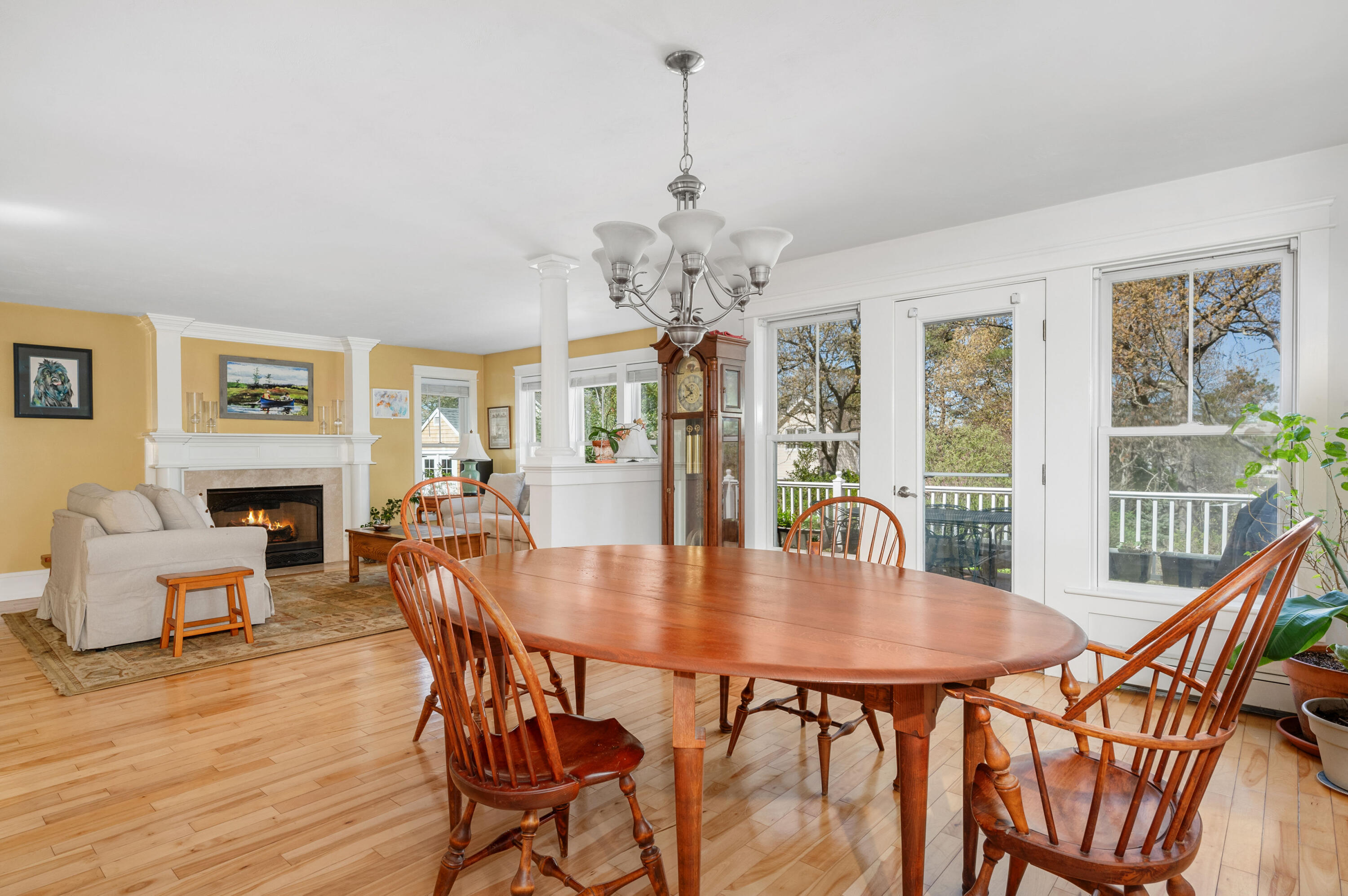 110 Clamshell Cove Road Cotuit, MA 02635 - Photo 15 of 56 a dining room with furniture wooden floor a chandelier and a painting