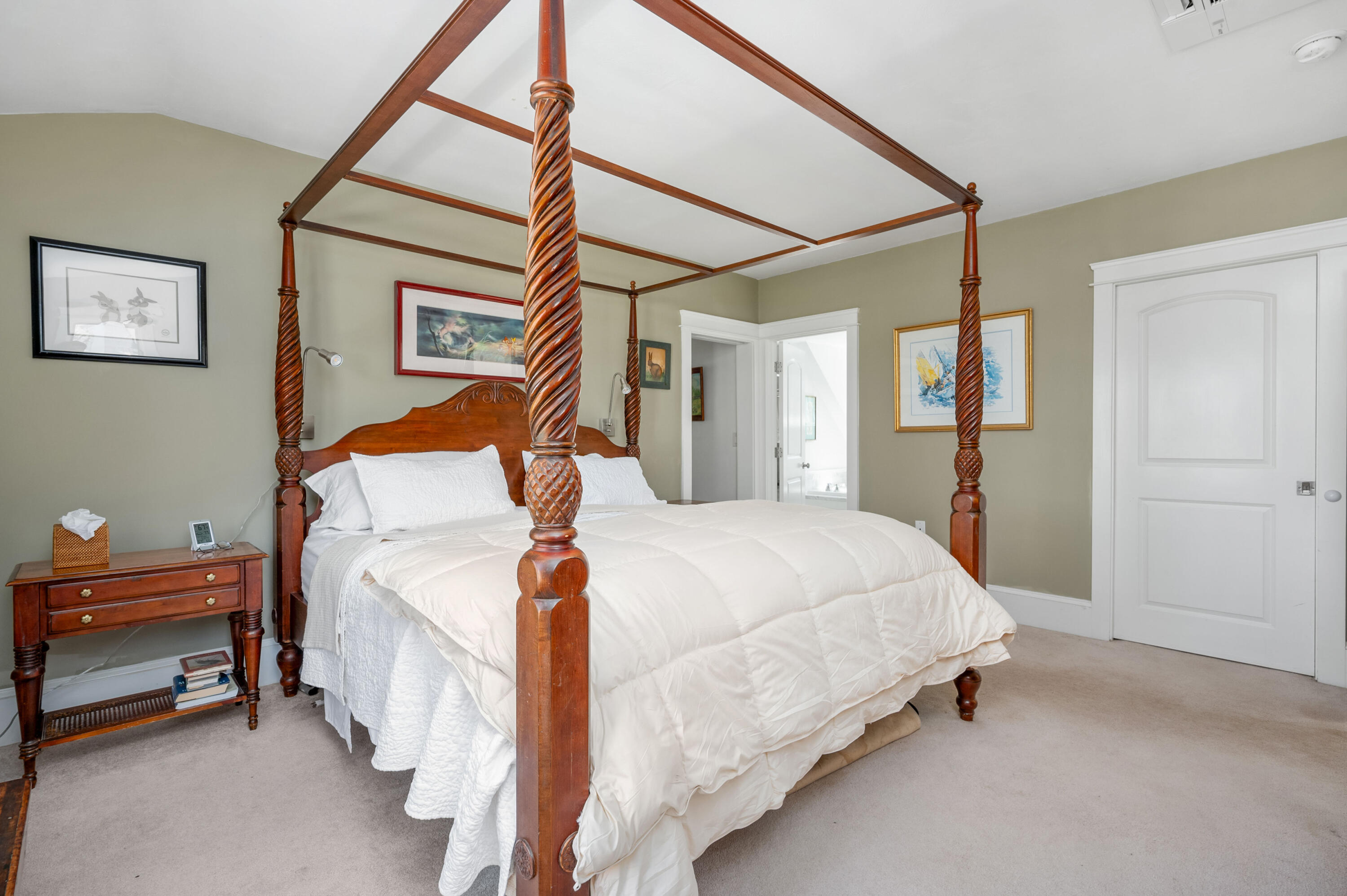 110 Clamshell Cove Road Cotuit, MA 02635 - Photo 18 of 56 a bedroom with a bed and a chandelier