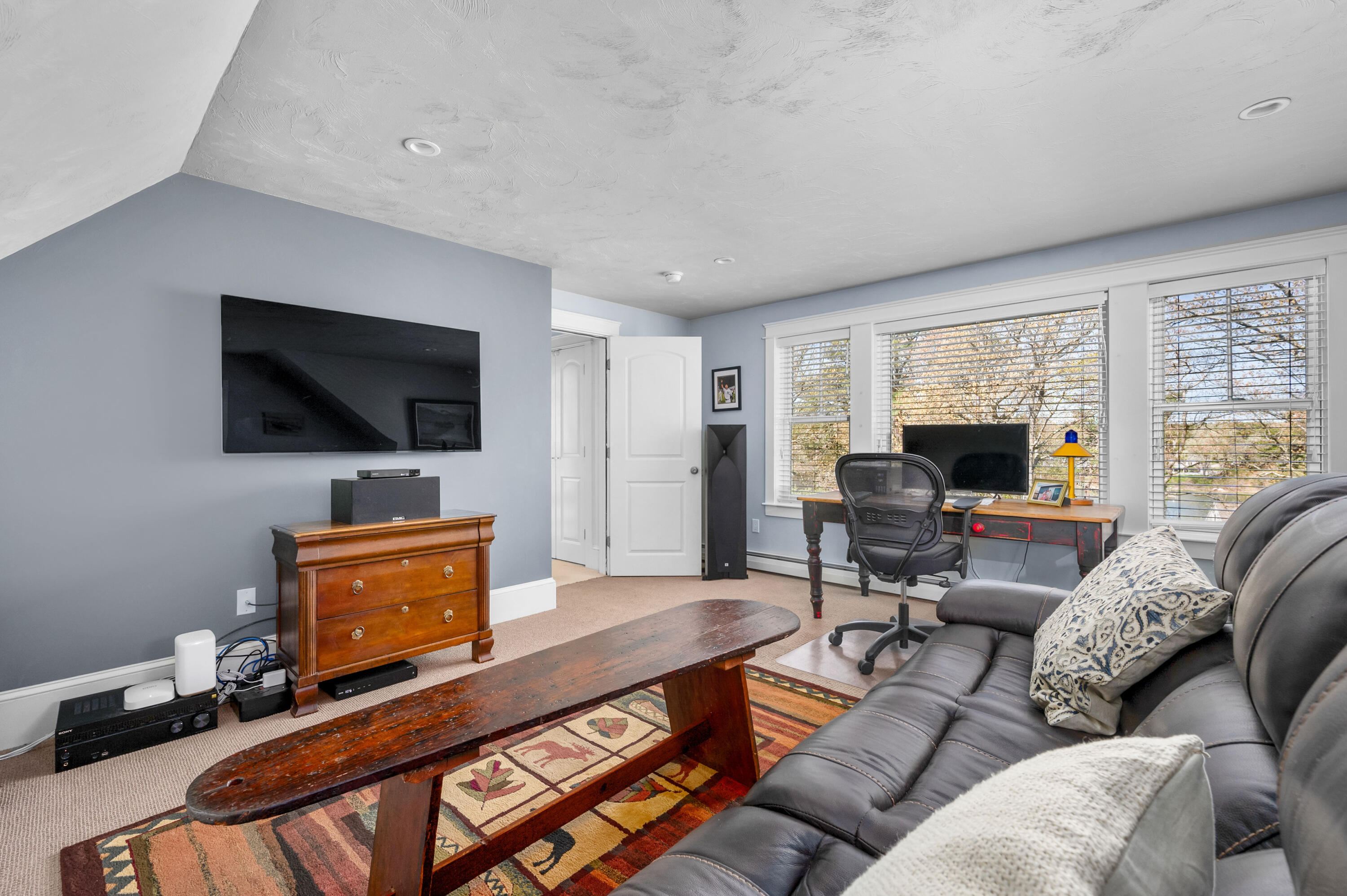 110 Clamshell Cove Road Cotuit, MA 02635 - Photo 22 of 56 a living room with furniture and a flat screen tv