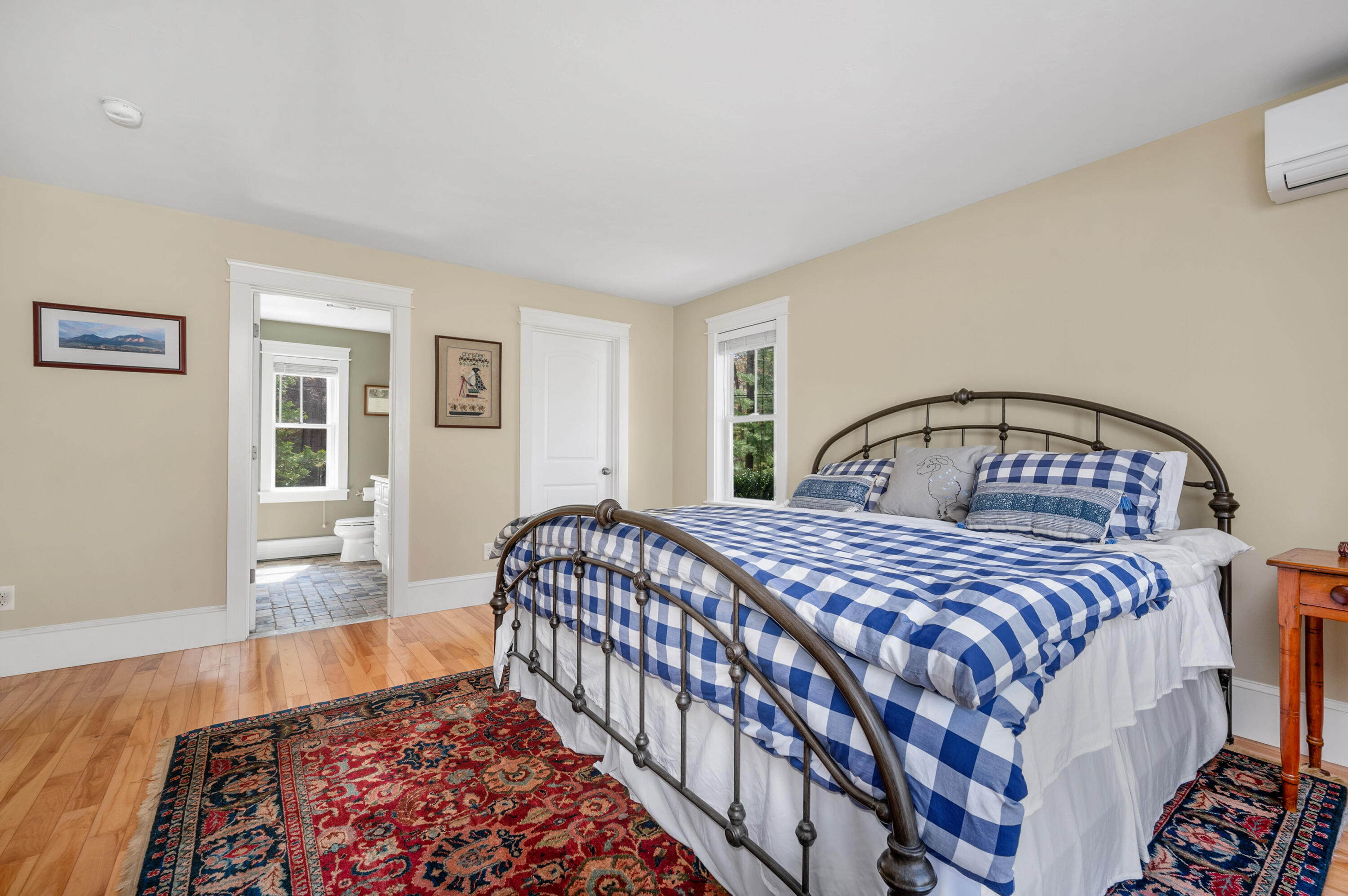 110 Clamshell Cove Road Cotuit, MA 02635 - Photo 23 of 56 a bedroom with a bed and wooden floor