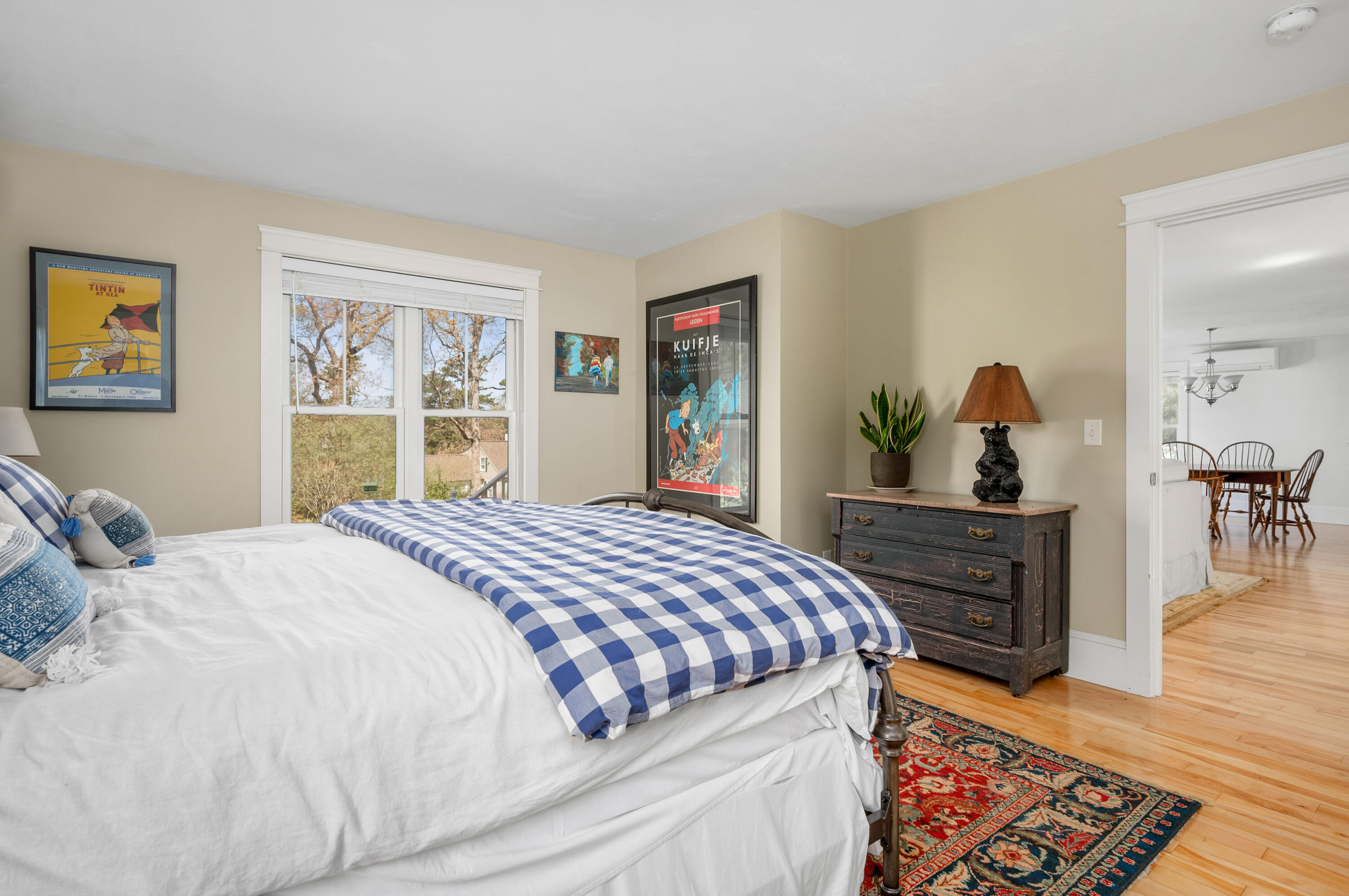 110 Clamshell Cove Road Cotuit, MA 02635 - Photo 25 of 56 a bedroom with a bed and wooden floor