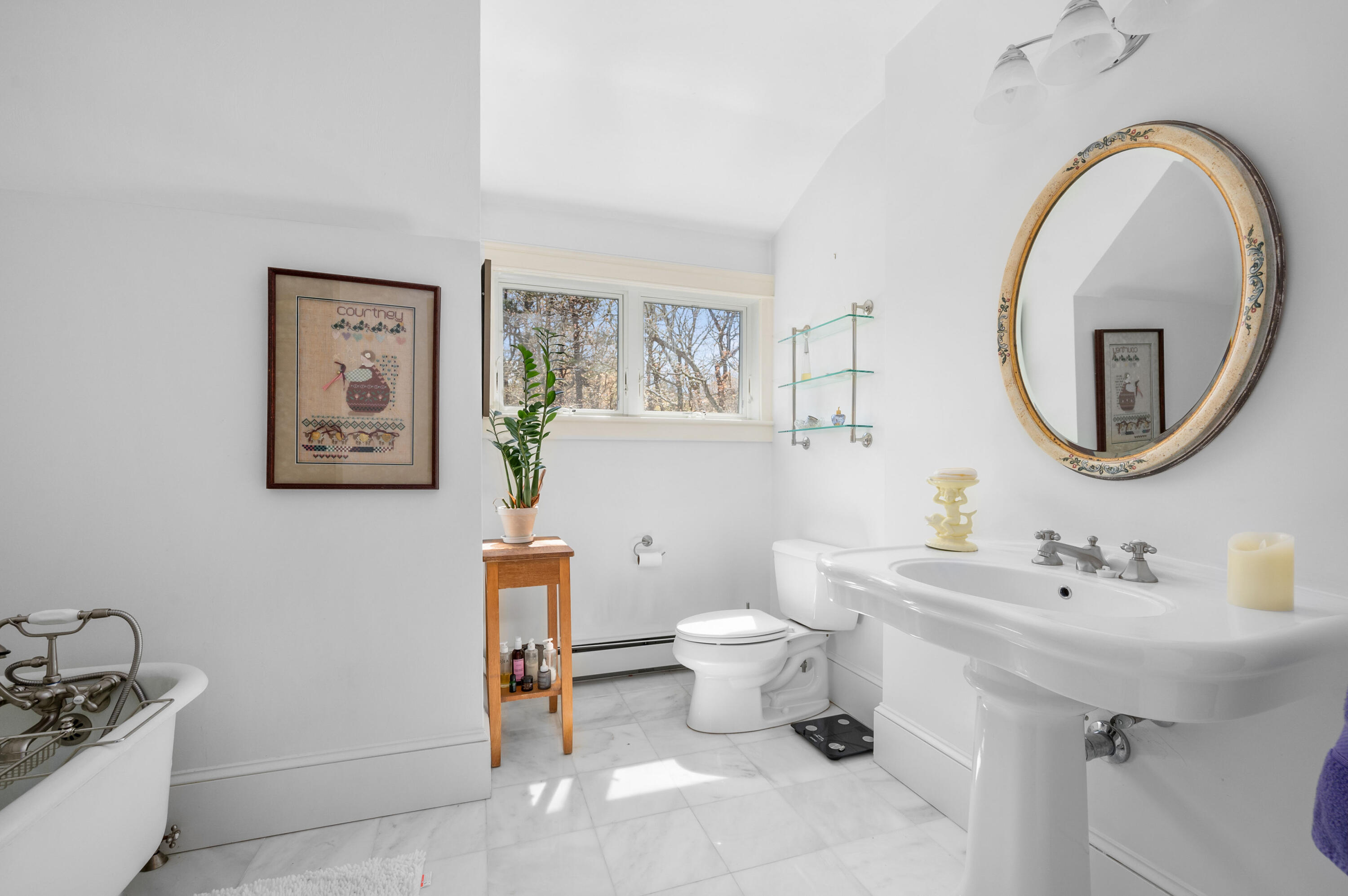 110 Clamshell Cove Road Cotuit, MA 02635 - Photo 29 of 56 a bathroom with a toilet a sink and a mirror