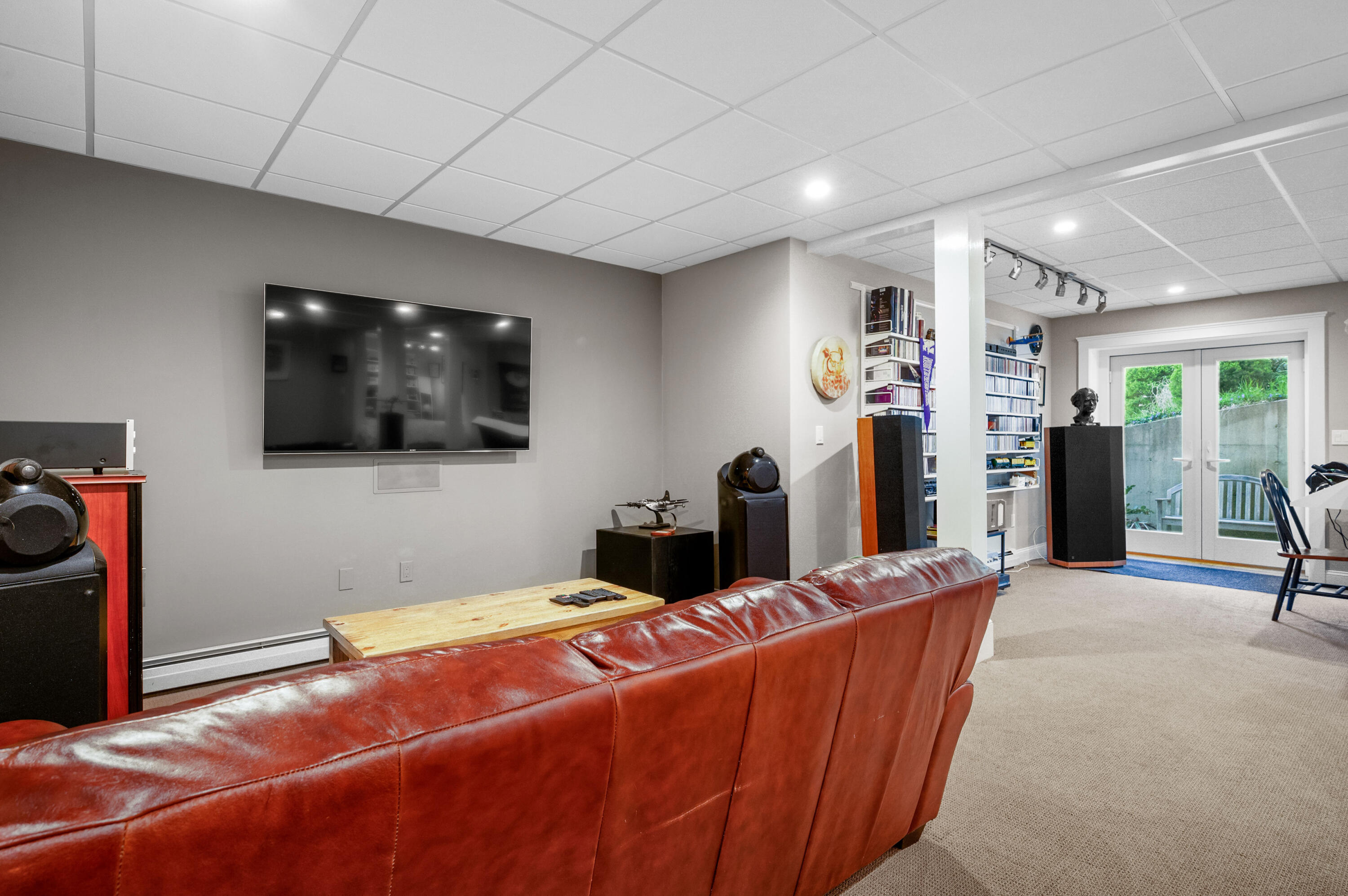 110 Clamshell Cove Road Cotuit, MA 02635 - Photo 33 of 56 a living room with furniture and a flat screen tv