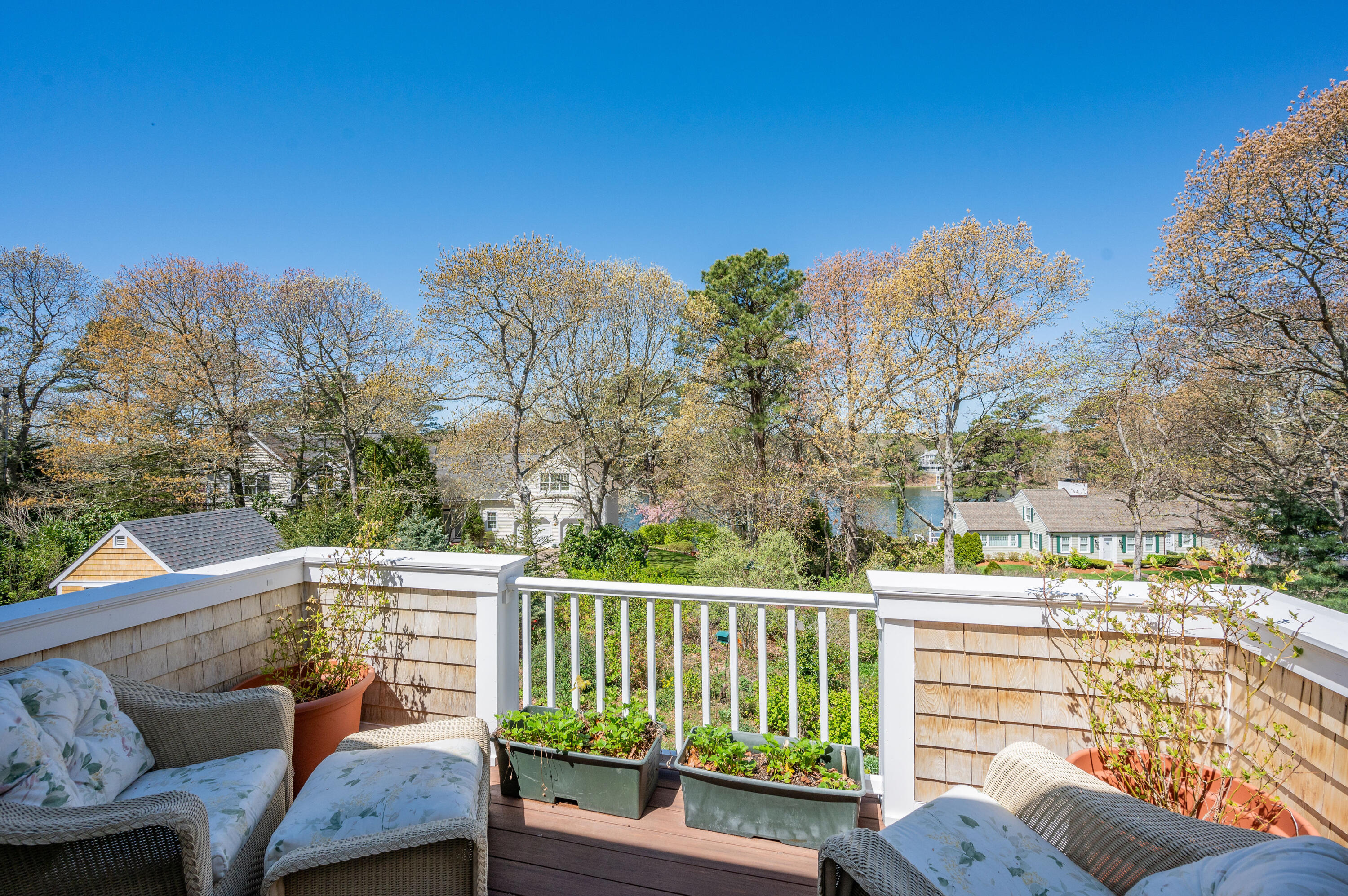 110 Clamshell Cove Road Cotuit, MA 02635 - Photo 36 of 56 a view of a chairs and table in the balcony