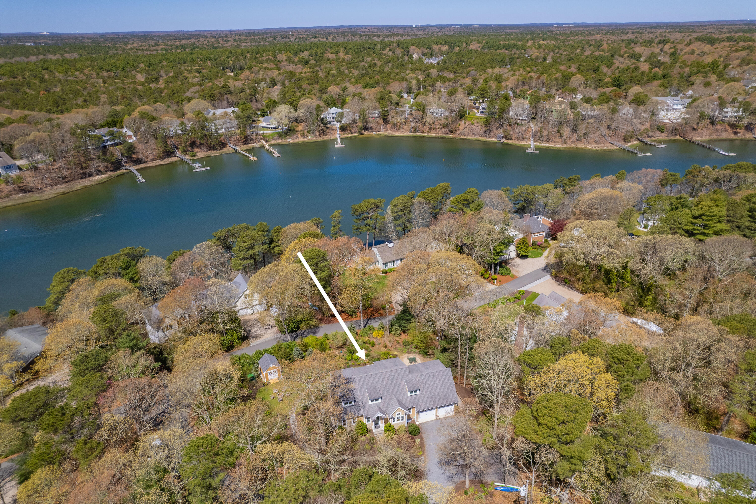 110 Clamshell Cove Road Cotuit, MA 02635 - Photo 44 of 56 an aerial view of residential houses with outdoor space and lake view