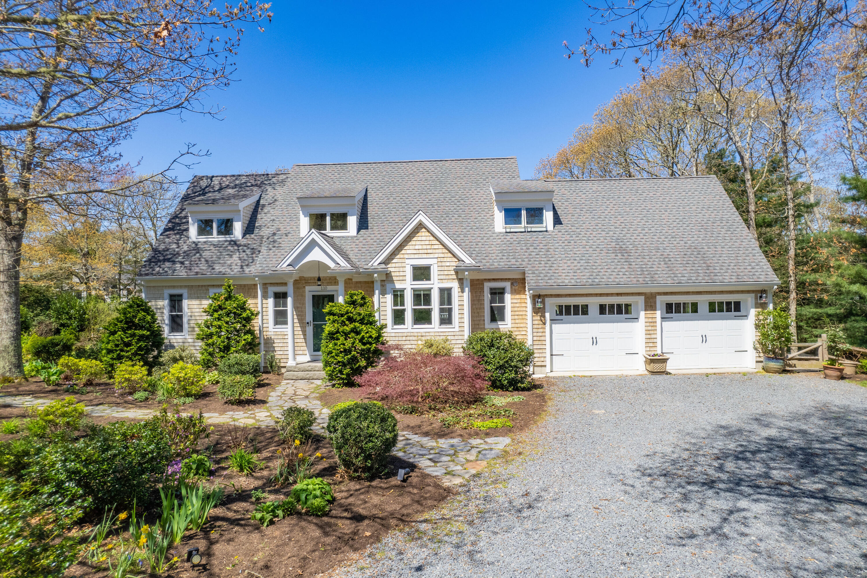 110 Clamshell Cove Road Cotuit, MA 02635 - Photo 51 of 56 front view of a house with a yard