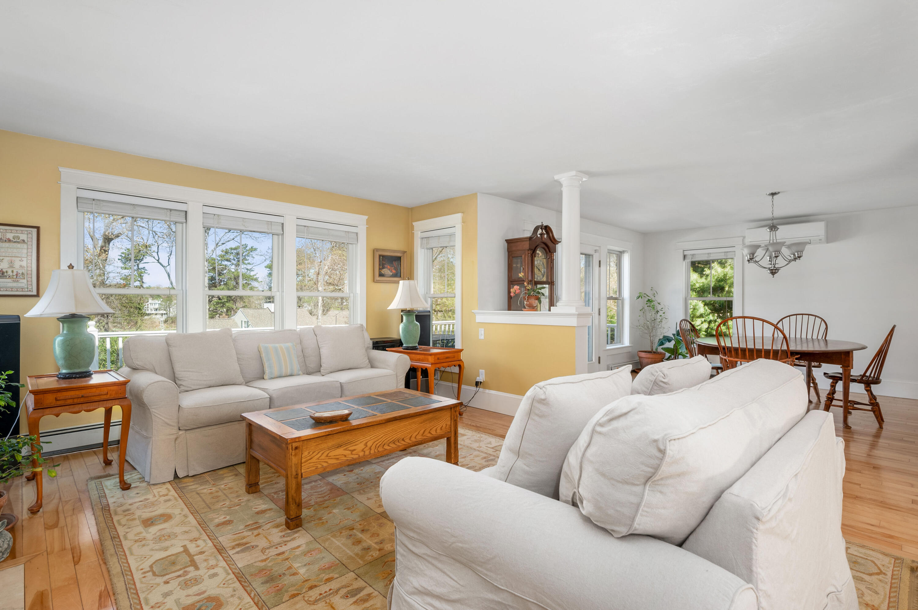 110 Clamshell Cove Road Cotuit, MA 02635 - Photo 8 of 56 a living room with furniture and a large window