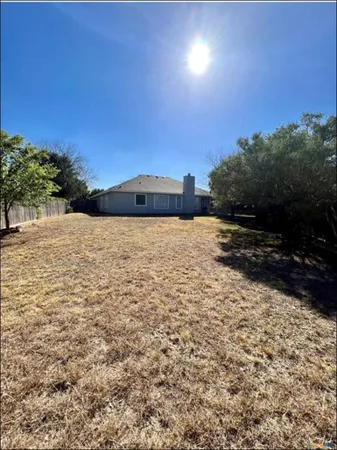 a view of a house with a tree