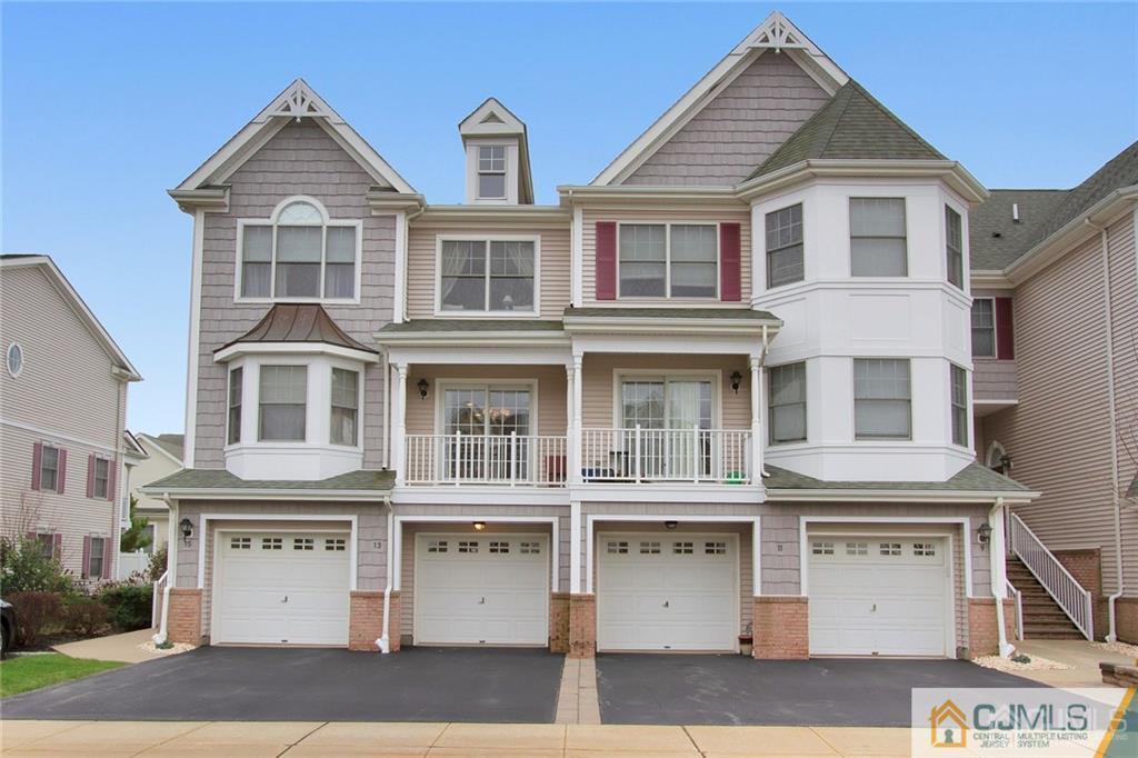 13 Raritan Reach Road, Unit 7 South Amboy, NJ 08879 - Photo 1 of 25 a front view of a large white building