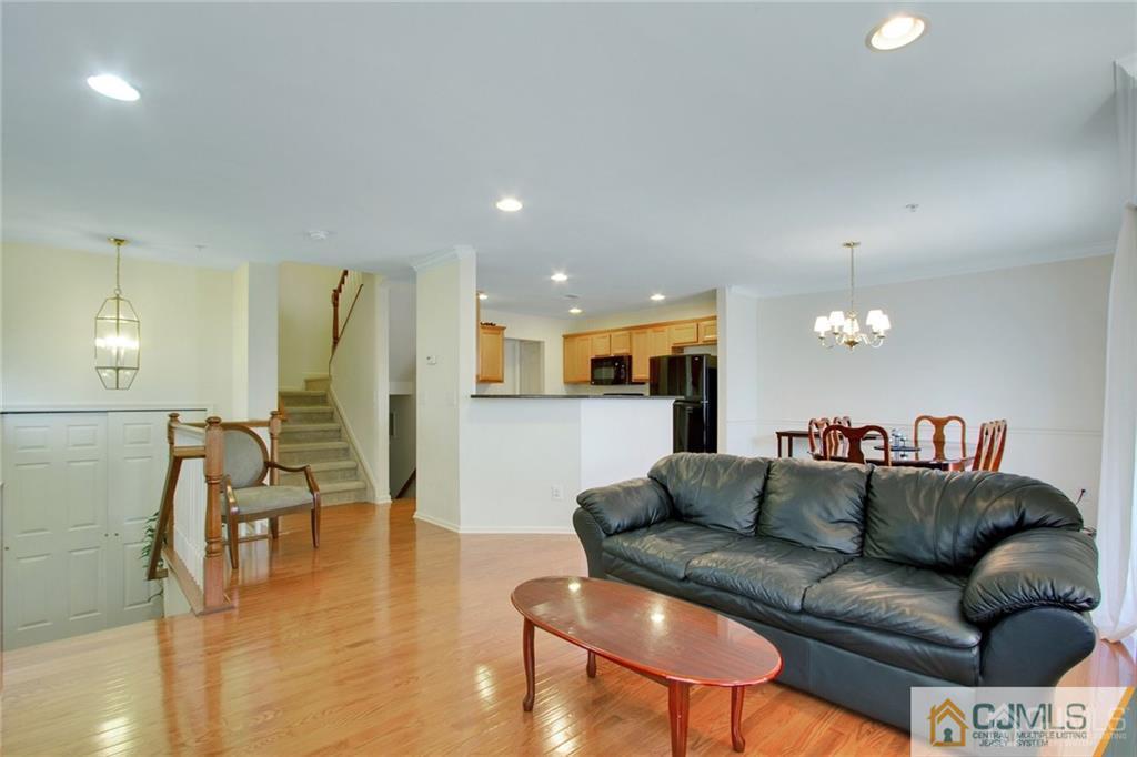 13 Raritan Reach Road, Unit 7 South Amboy, NJ 08879 - Photo 7 of 25 a living room with furniture and kitchen view