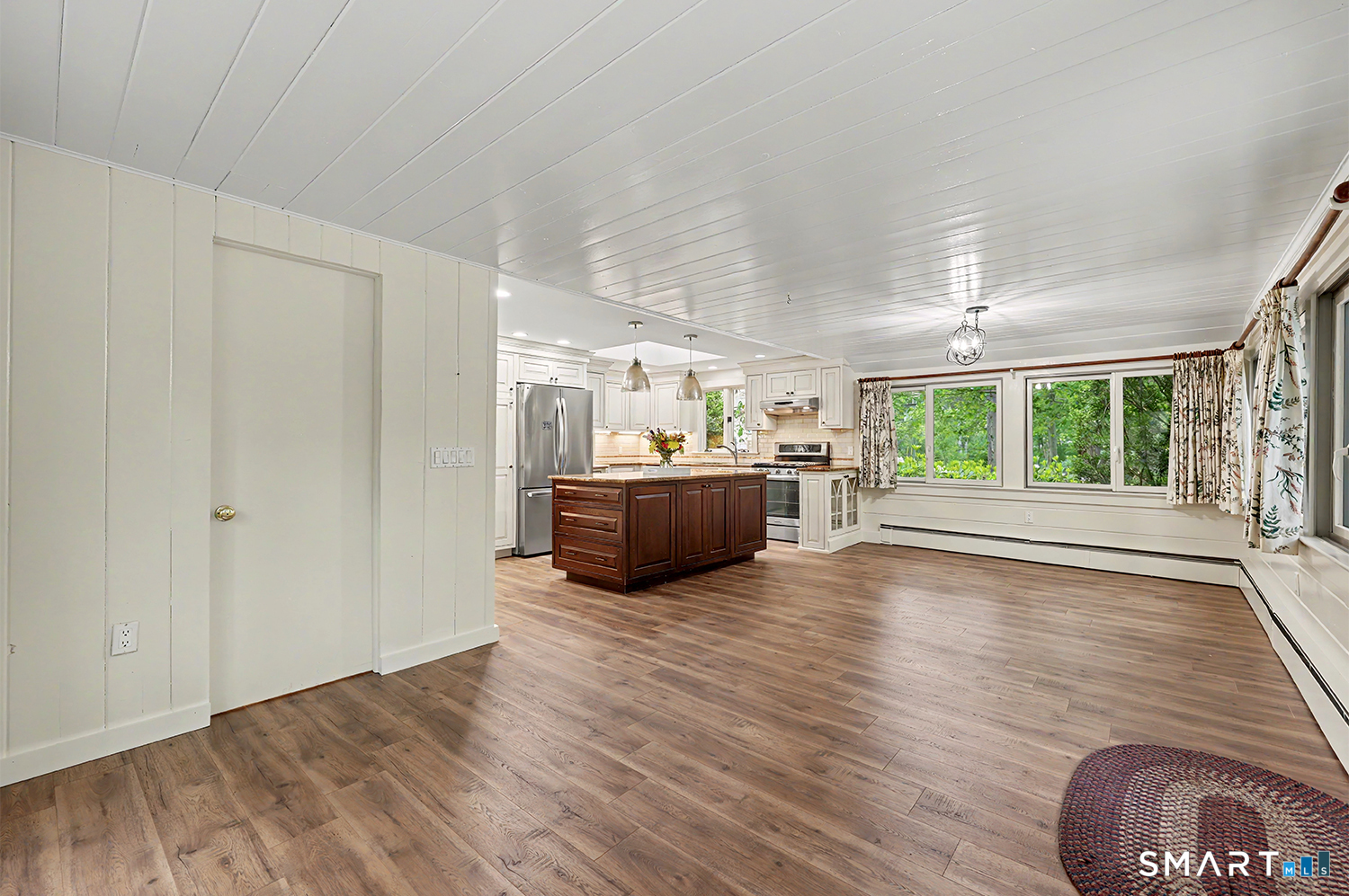 19 Geneva Road Norwalk, CT 06850 - Photo 15 of 33 a view of a big room with wooden floor and windows
