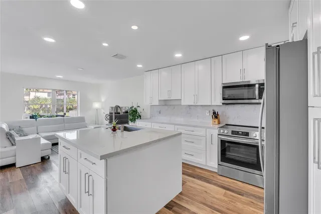 a bathroom with a sink toilet and mirror