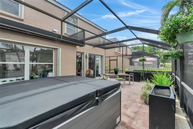 an aerial view of residential houses with outdoor space and street view