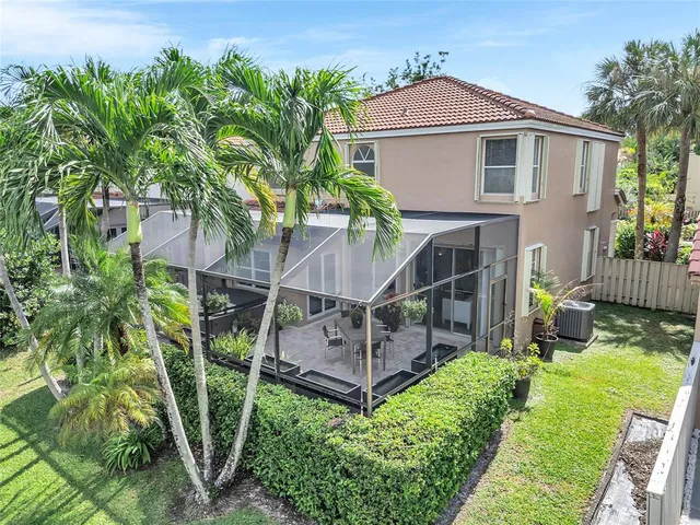 an aerial view of a house with a lake view