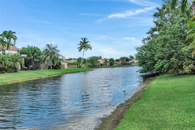 a view of a lake with a building in the background