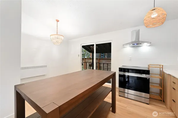 a kitchen with a table and chairs