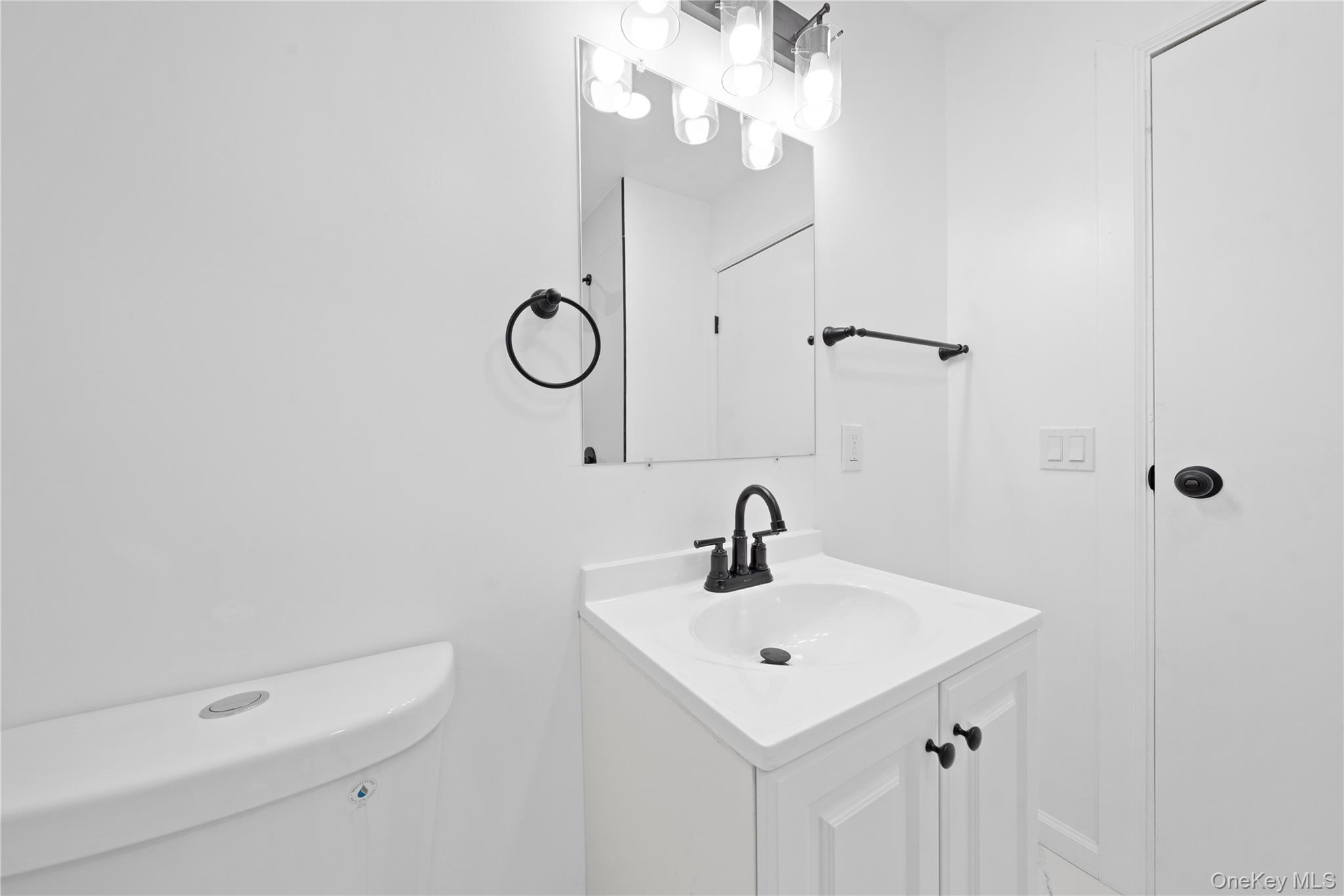 193 North Arizona Road West Babylon, NY 11704 - Photo 17 of 37 a bathroom with a sink a toilet and shower